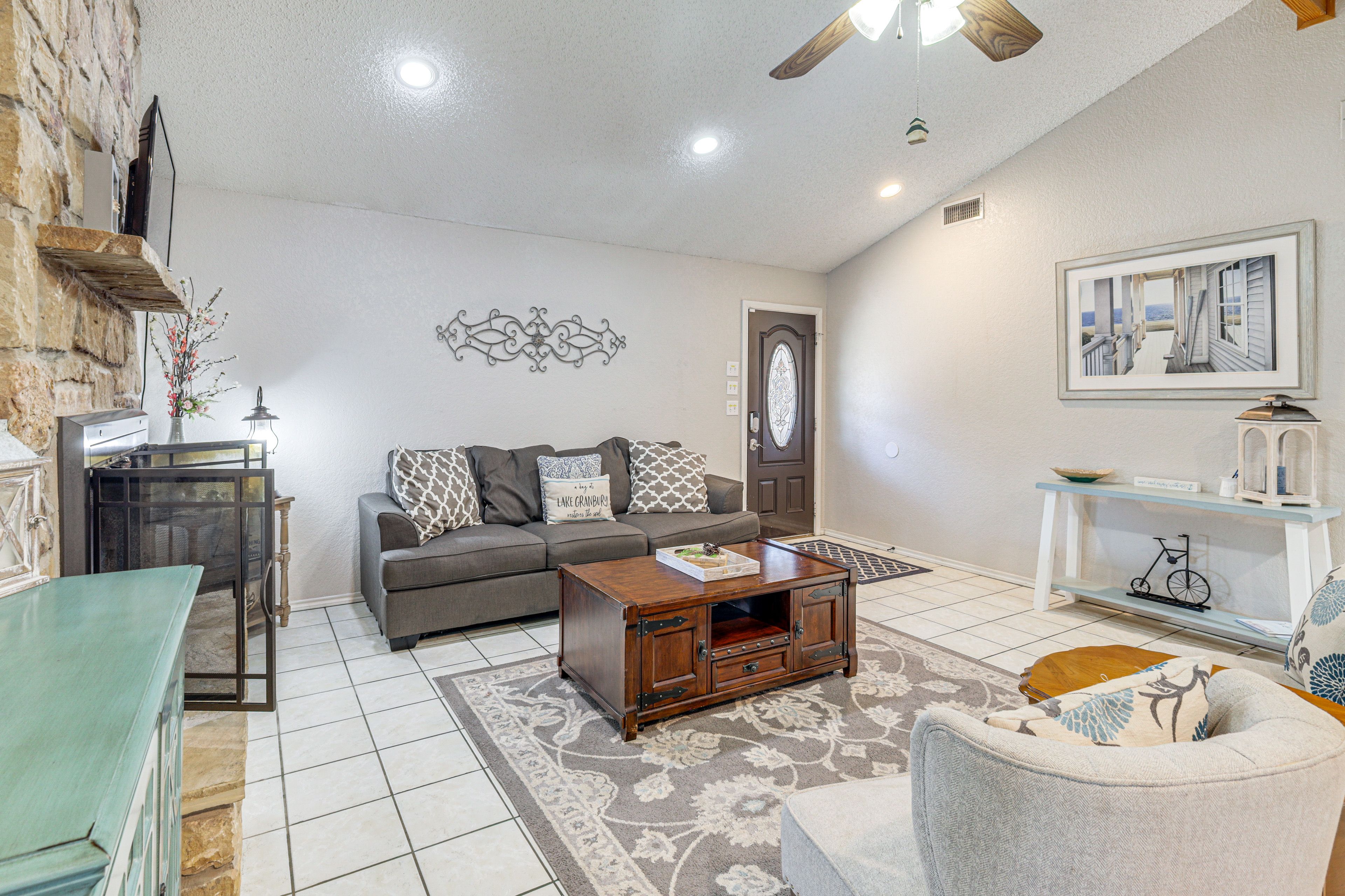 Living Room 2 | Exposed Wood Beams | 2-Sided Wood-Burning Fireplace | Main Level