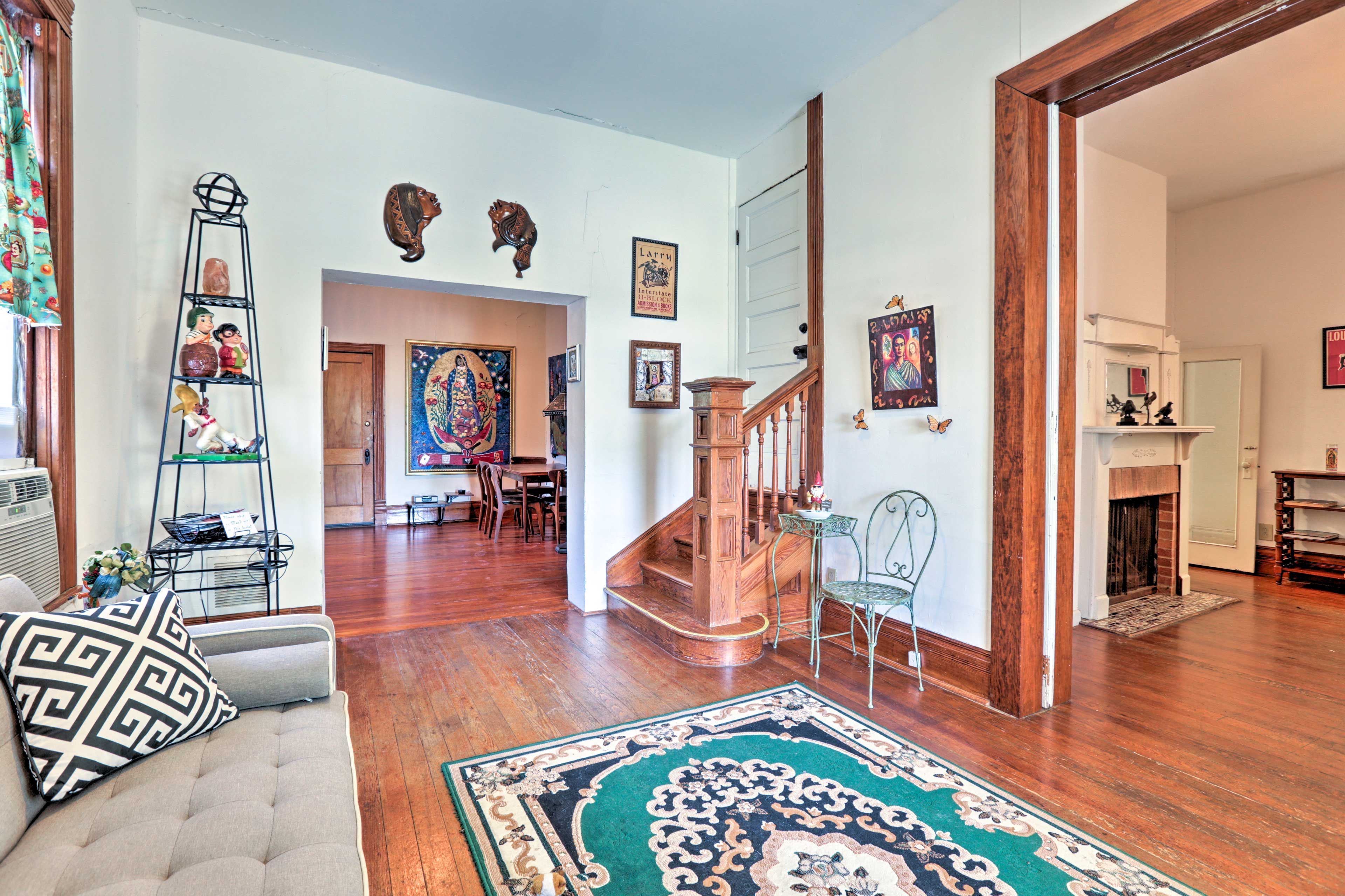 Vintage hardwood floors & art showcased everywhere characterize the interior.