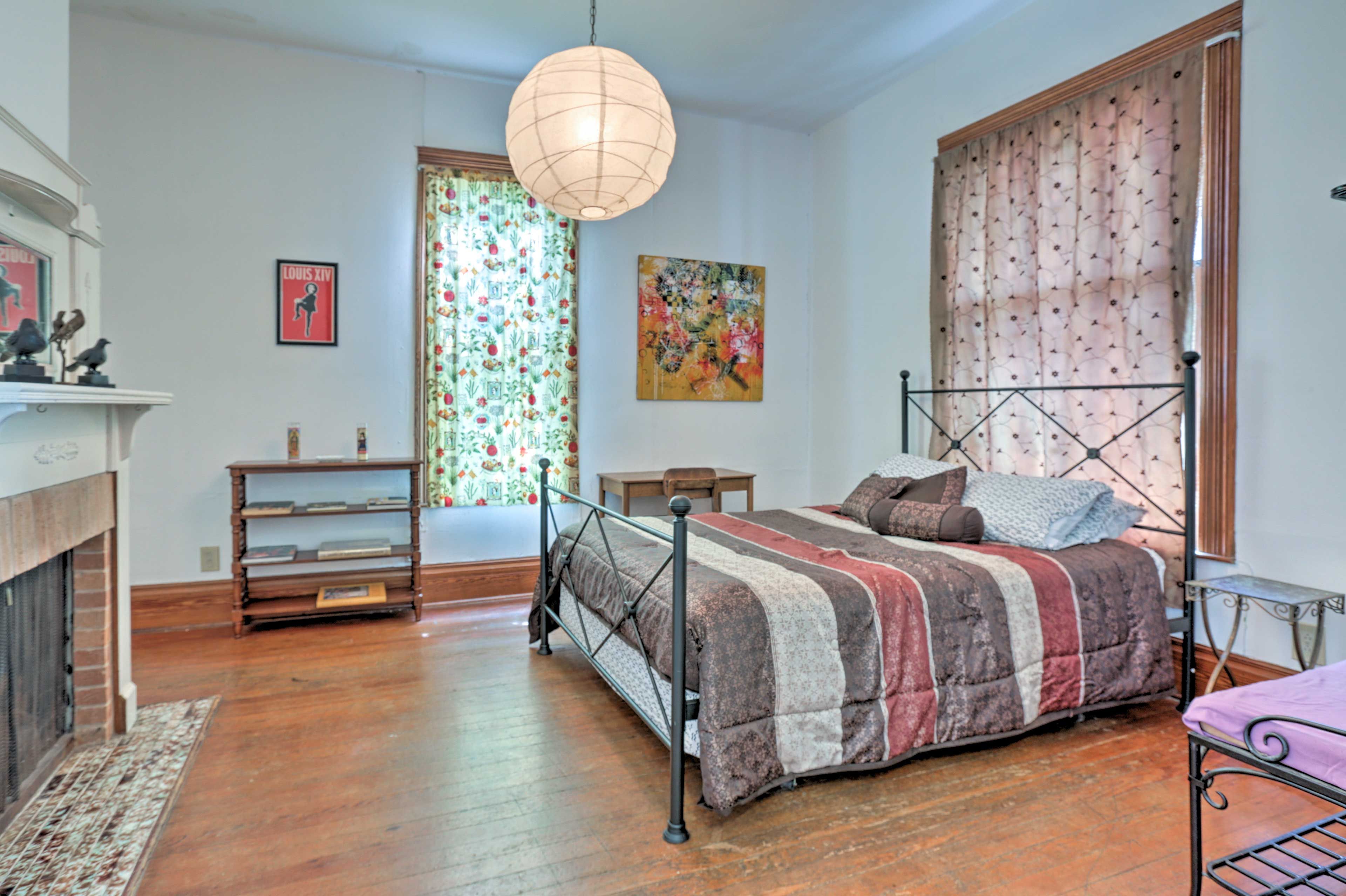 This expansive bedroom boasts funky decor.