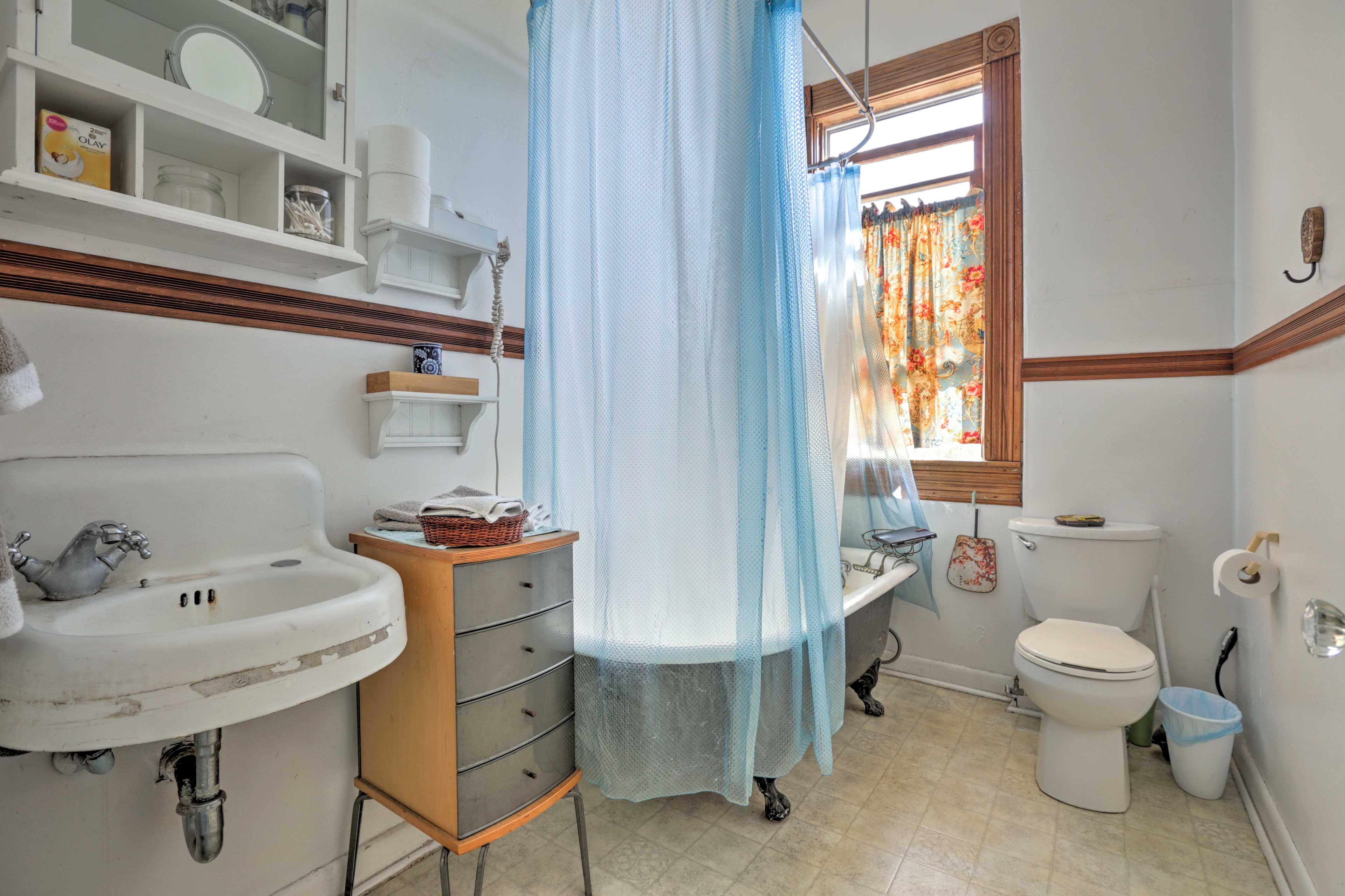This traditional clawfoot tub gives the bathroom a charming vintage vibe.