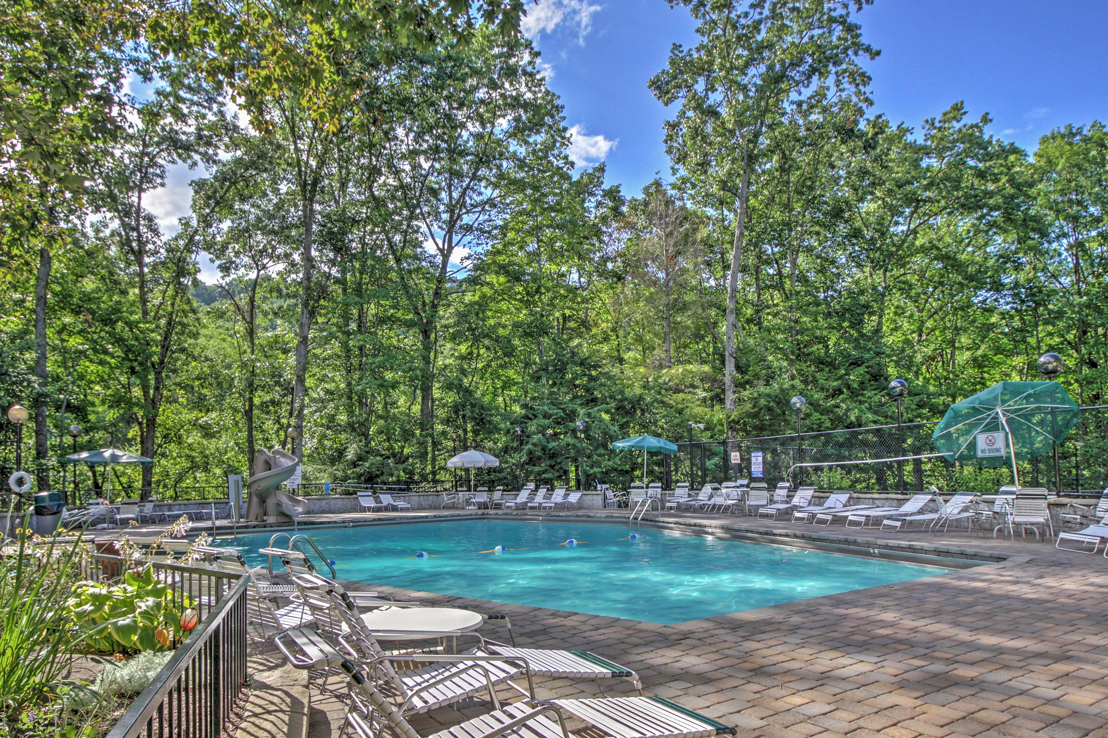 The 4-bedroom, 3-bathroom cabin has access to the community pool and more.