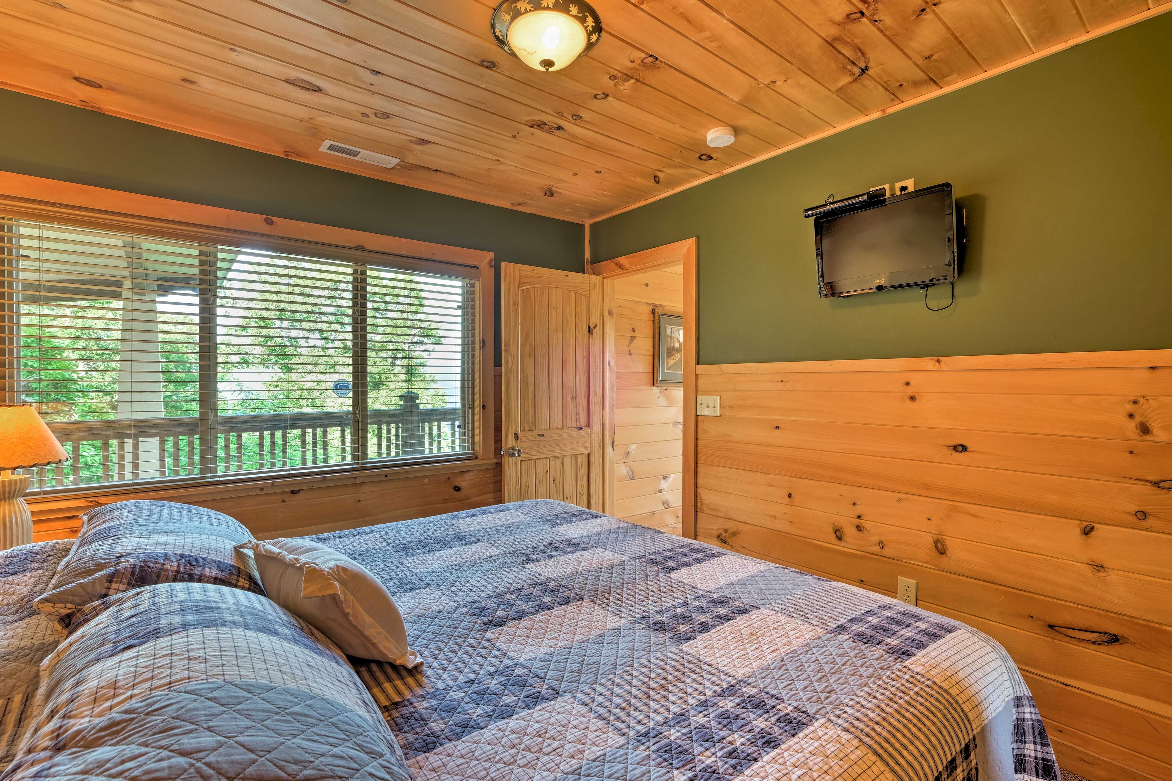 Watch a movie on the flat-screen cable TV from the comfort of your bed.