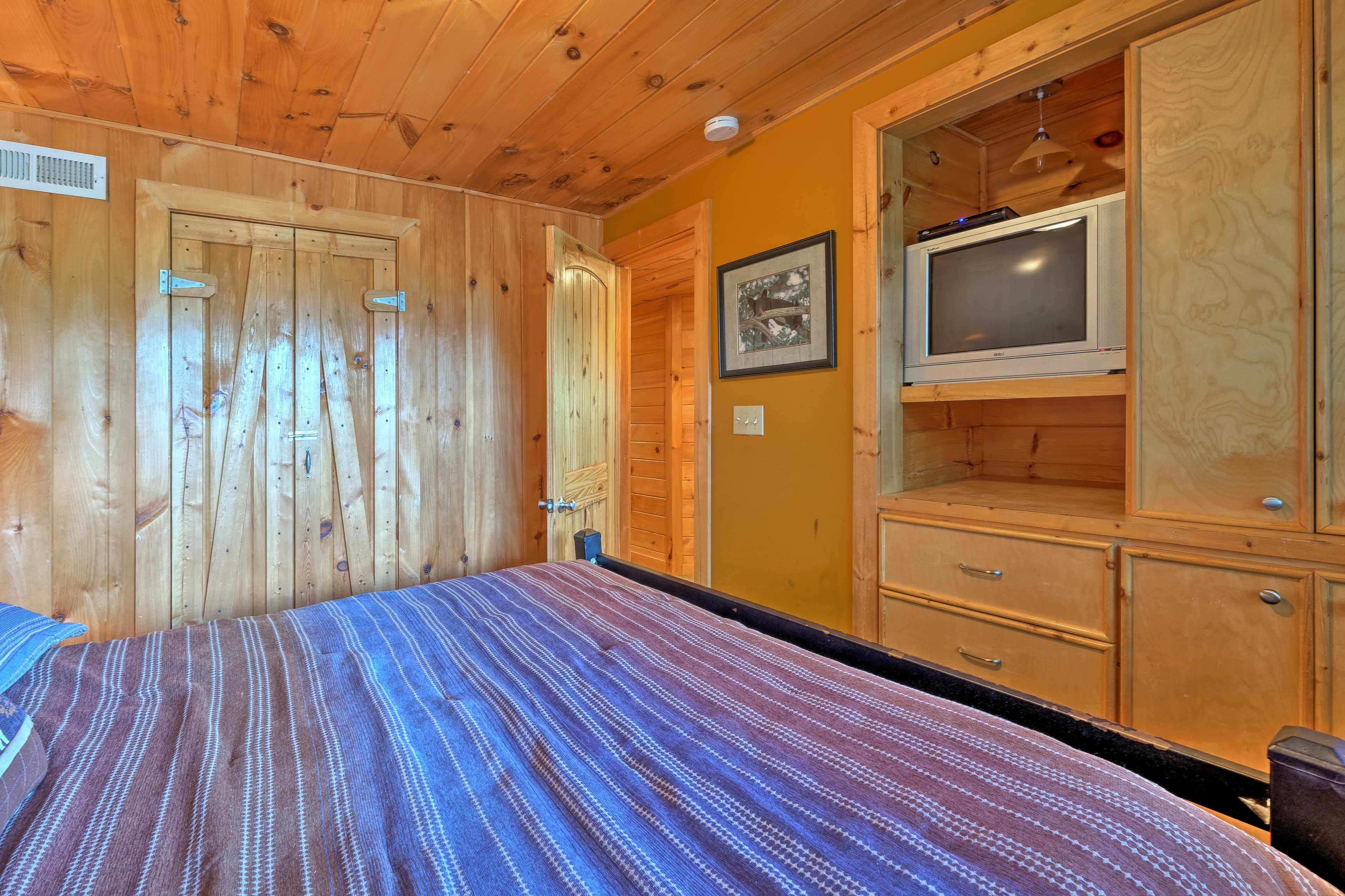 Doze off in the cloud-like king bed while watching cable TV.