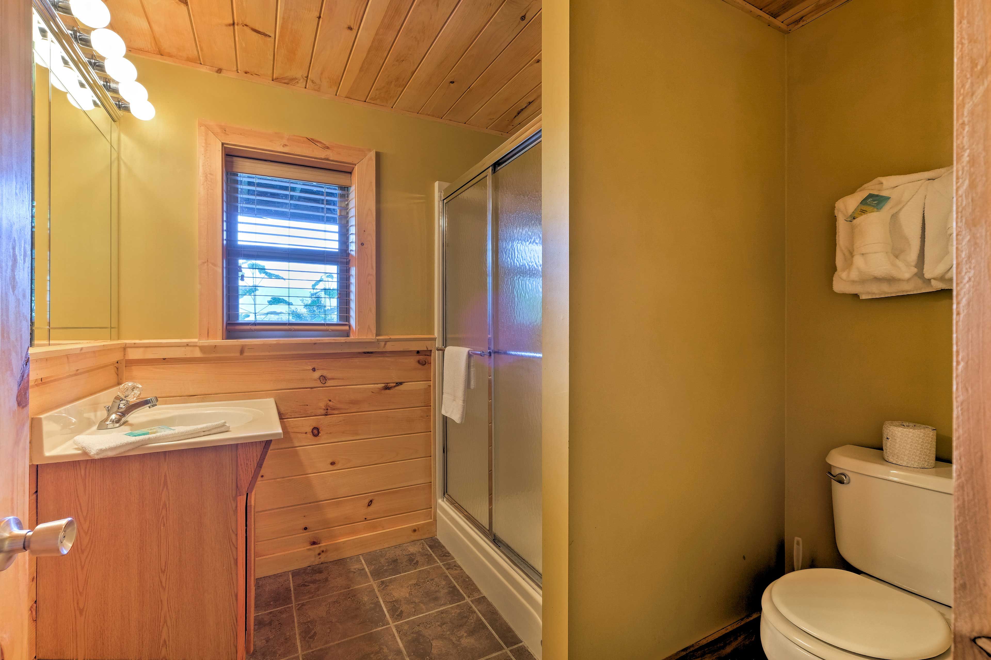 This second full bathroom hosts a spacious walk-in shower.