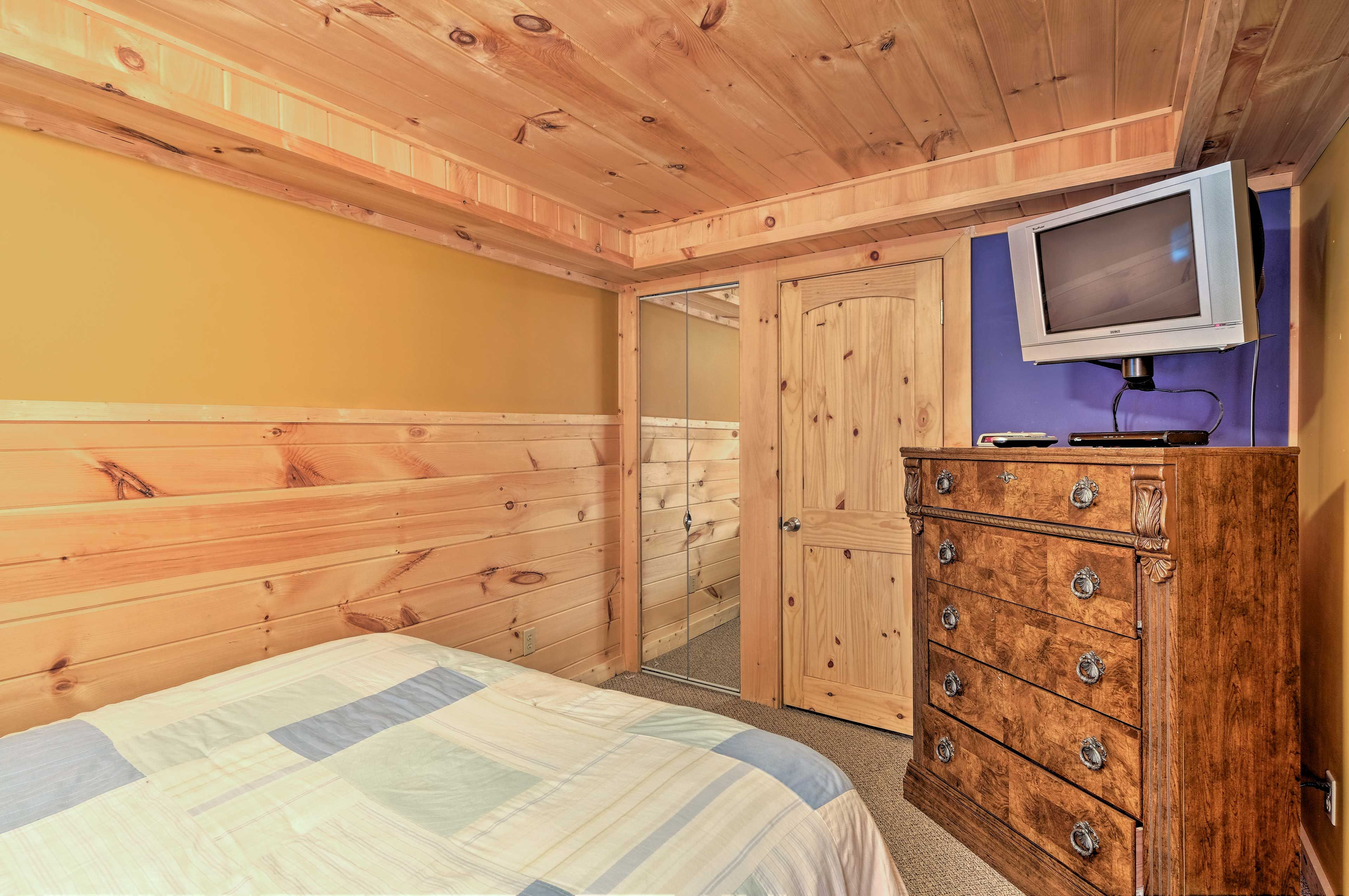 Peaceful slumber awaits in the soft queen bed.