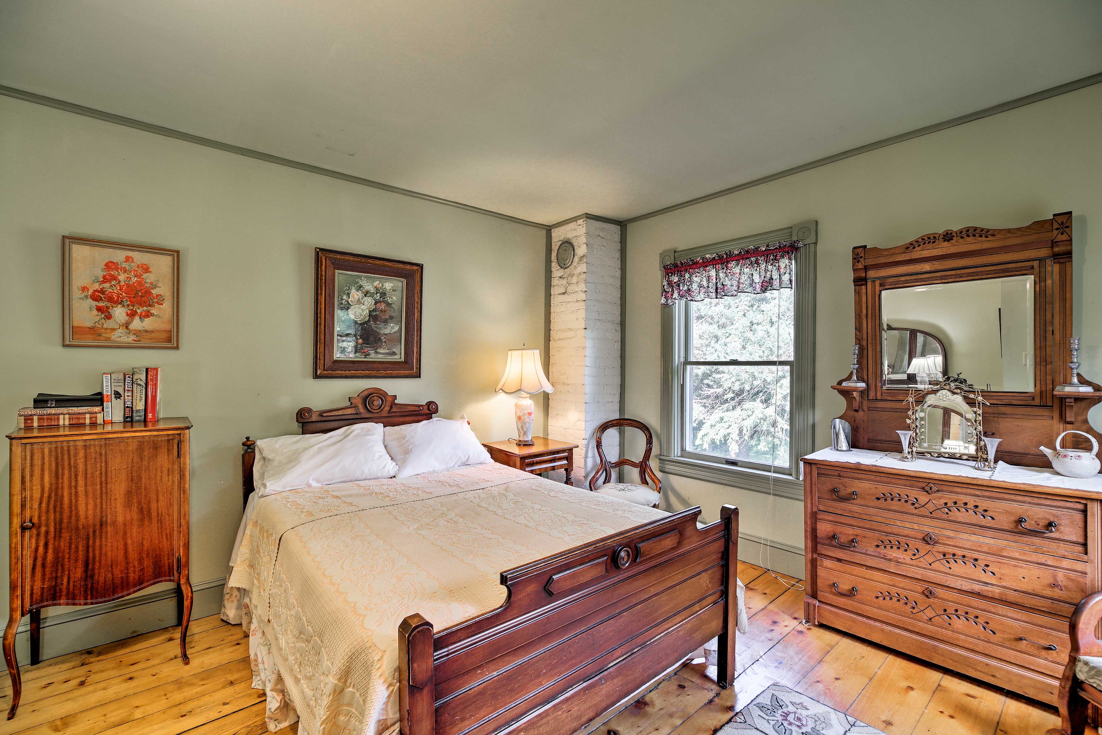 The main house includes 6 private bedrooms and an added sun porch.