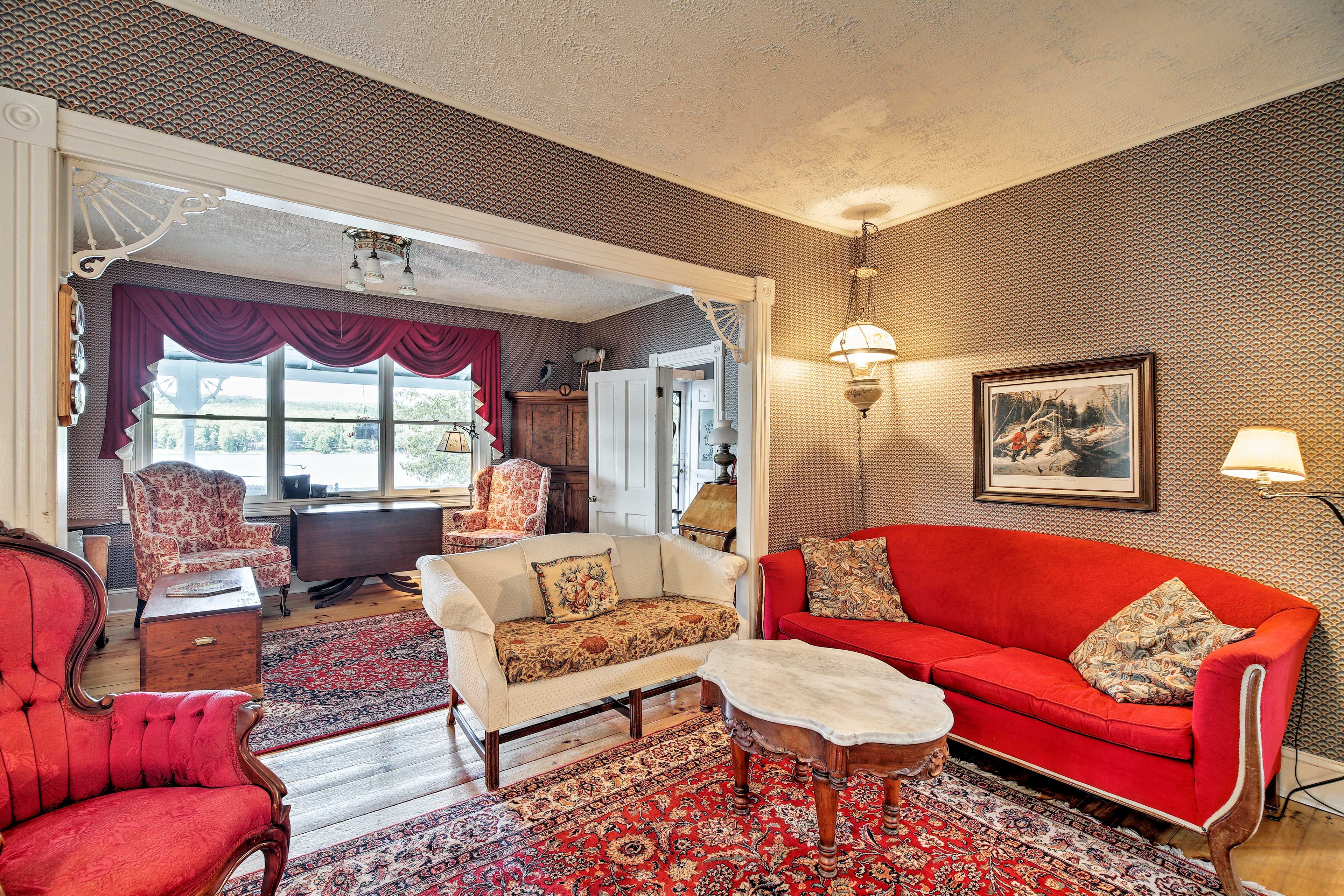 The living room includes 2 comfortable sofas and an armchair.