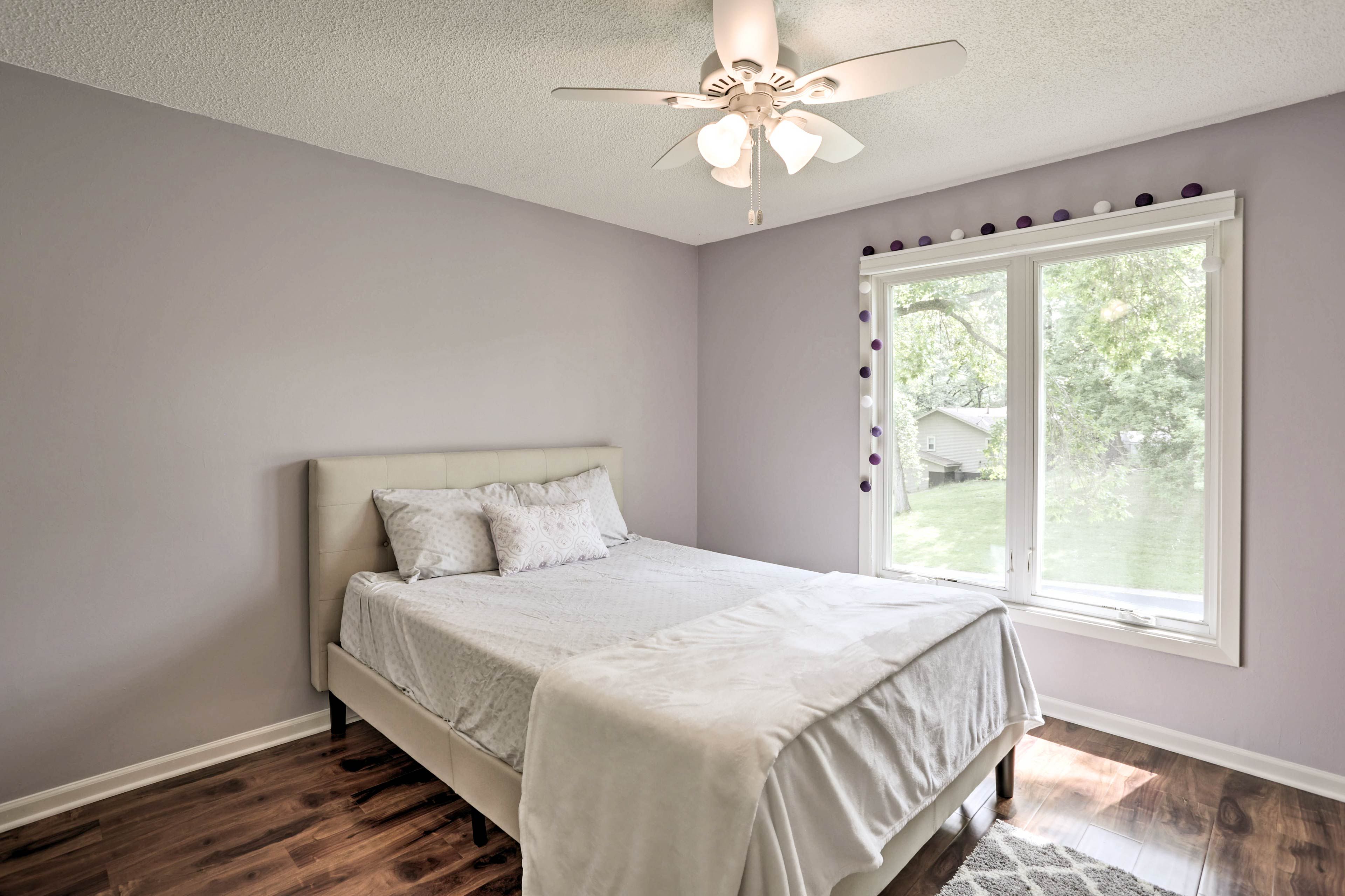 Climb under the covers of this queen bed in the second bedroom.
