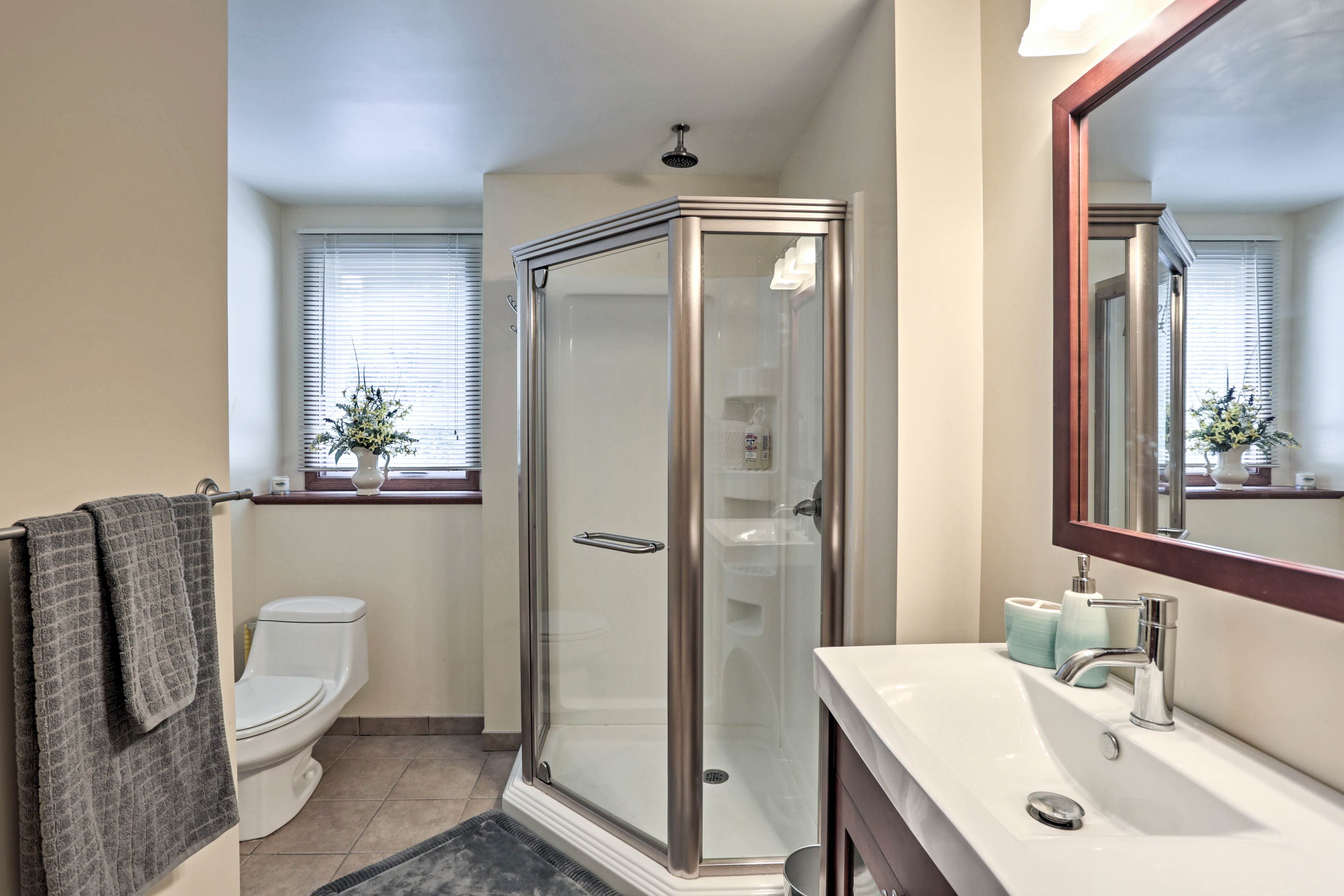 Get ready for a night out in the second bathroom with a walk-in shower.