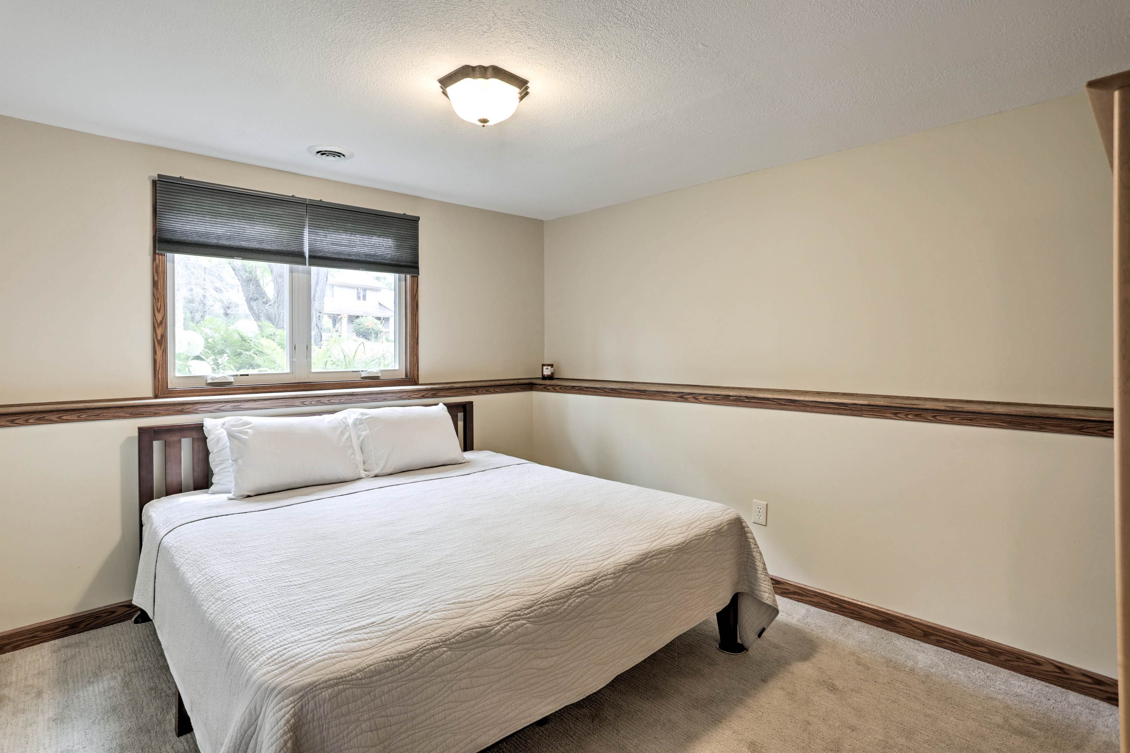 The final bedroom boasts a soft king-sized bed.