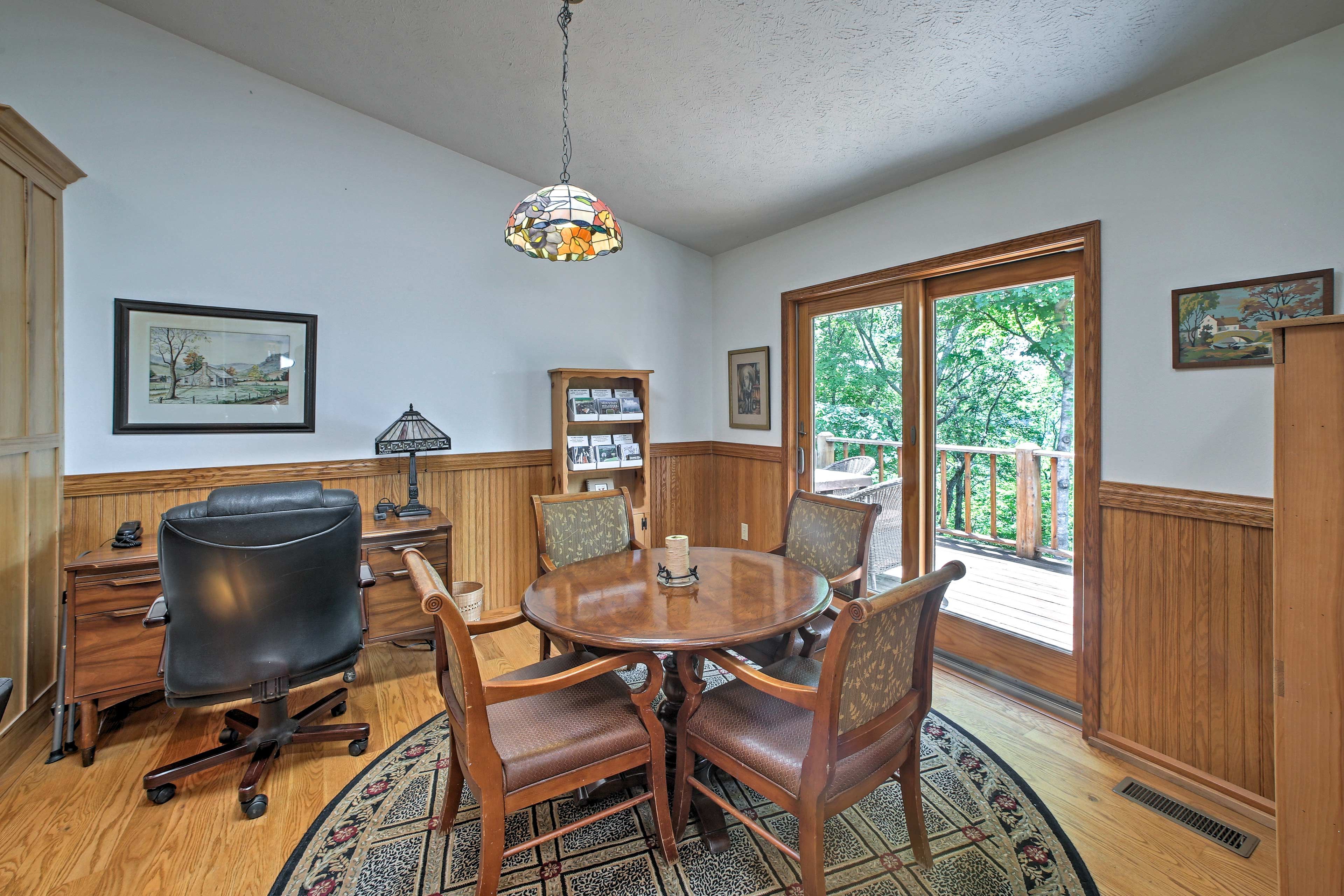 Natural light streams through doors that lead to the deck.
