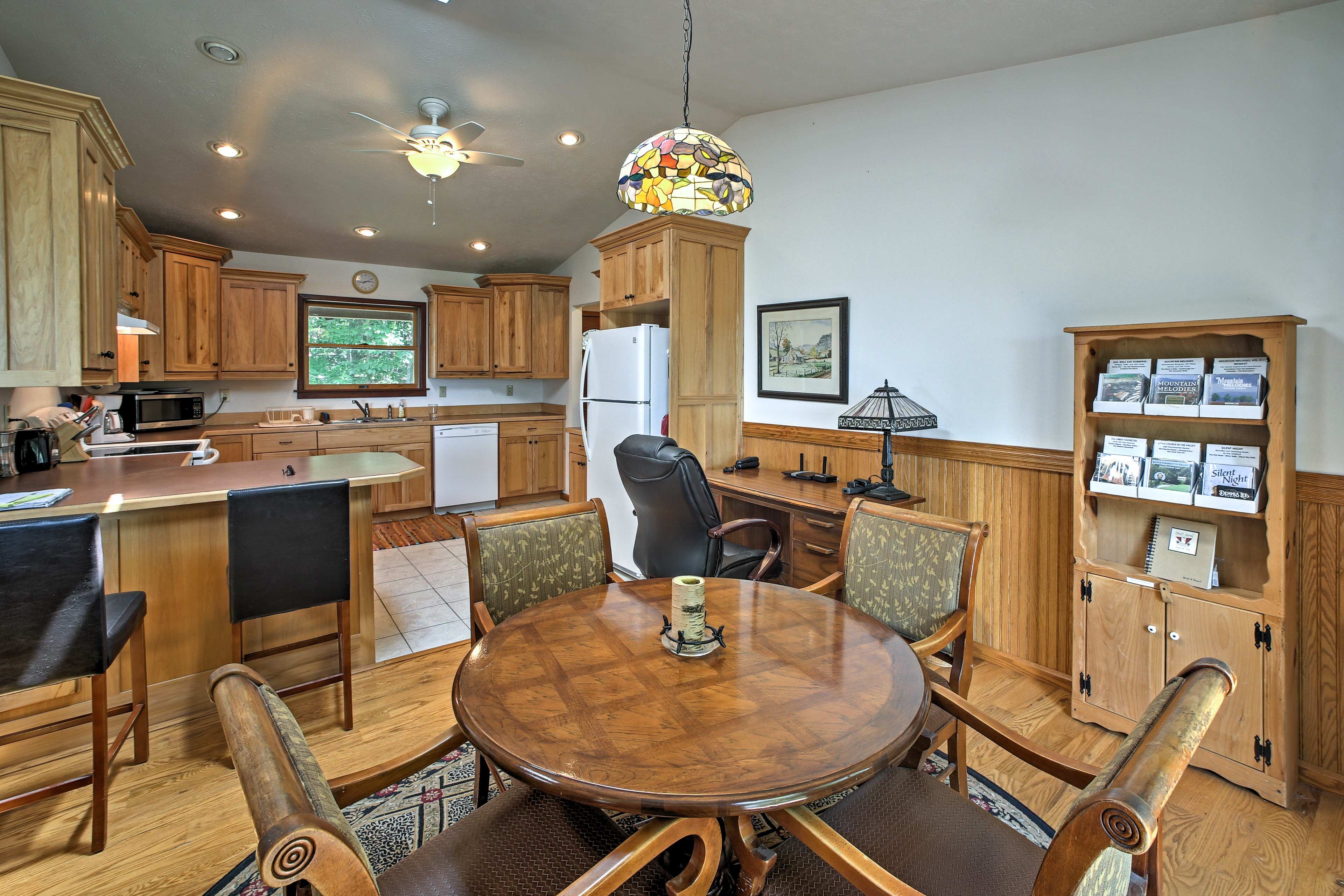 The dining table seats 4, the counter seats 2.