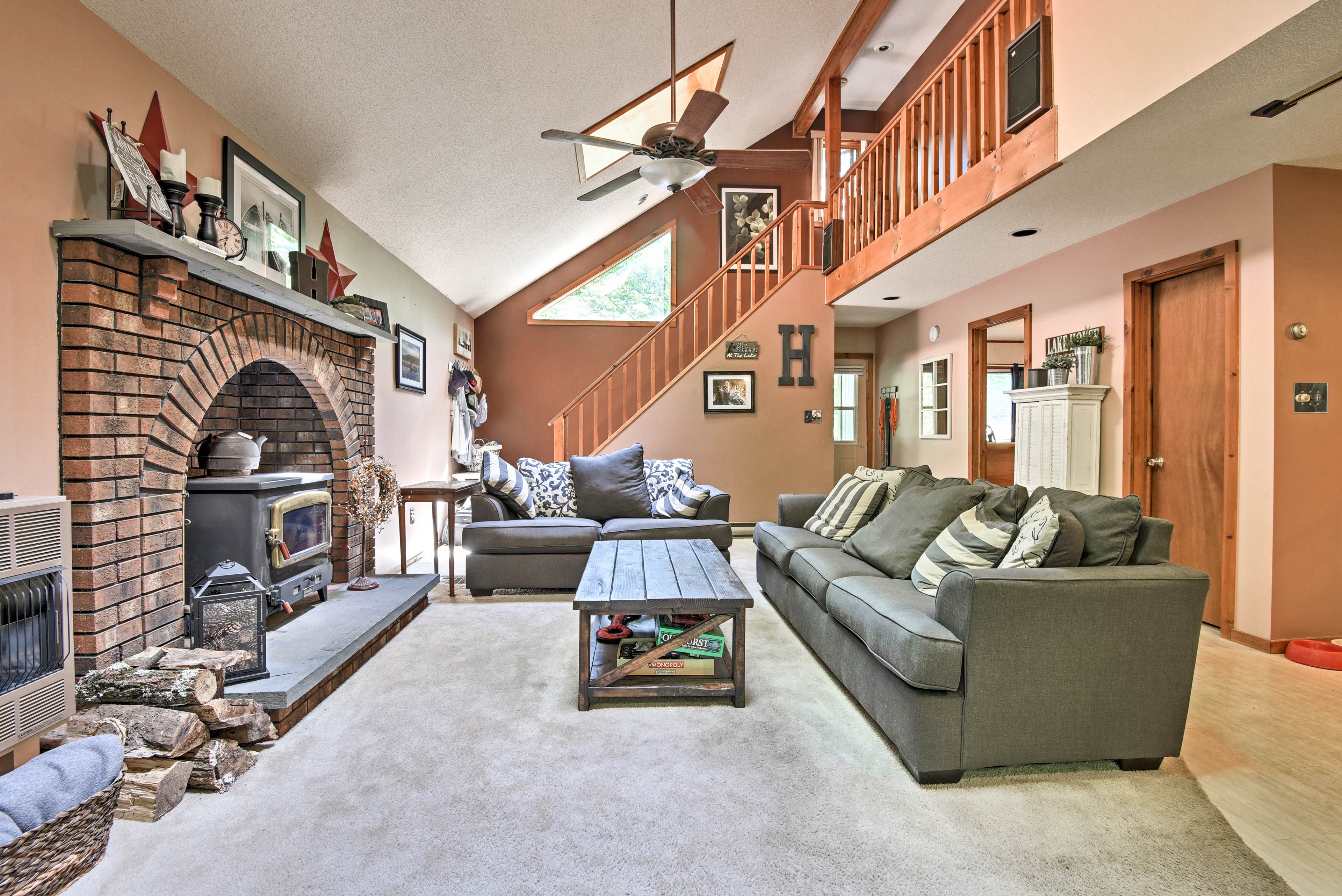The arched brick fireplace anchors this main living room.
