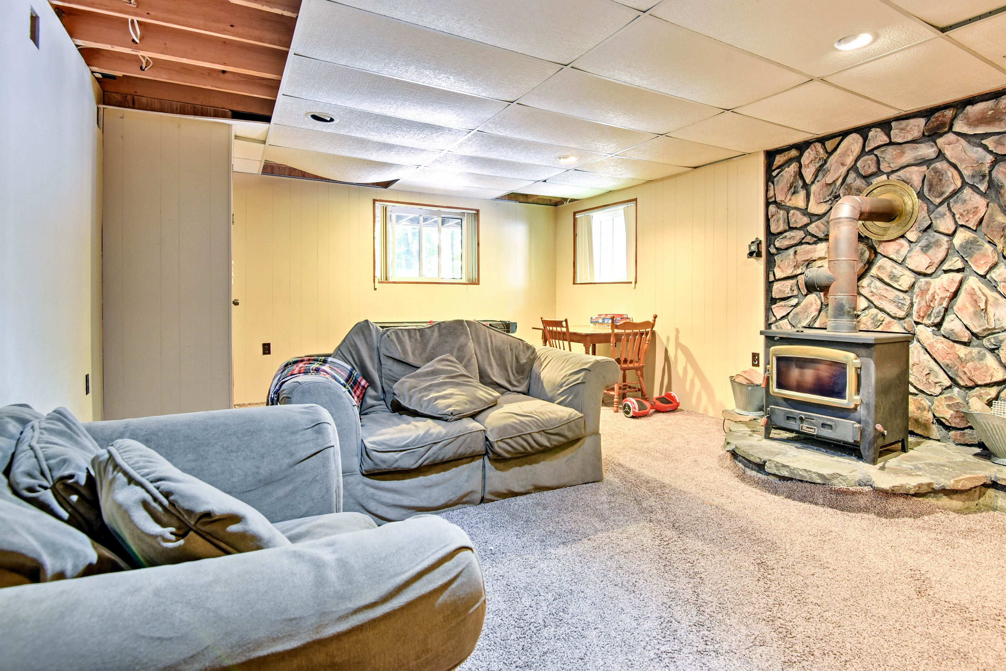 The finished basement provides a wood-burning stove.