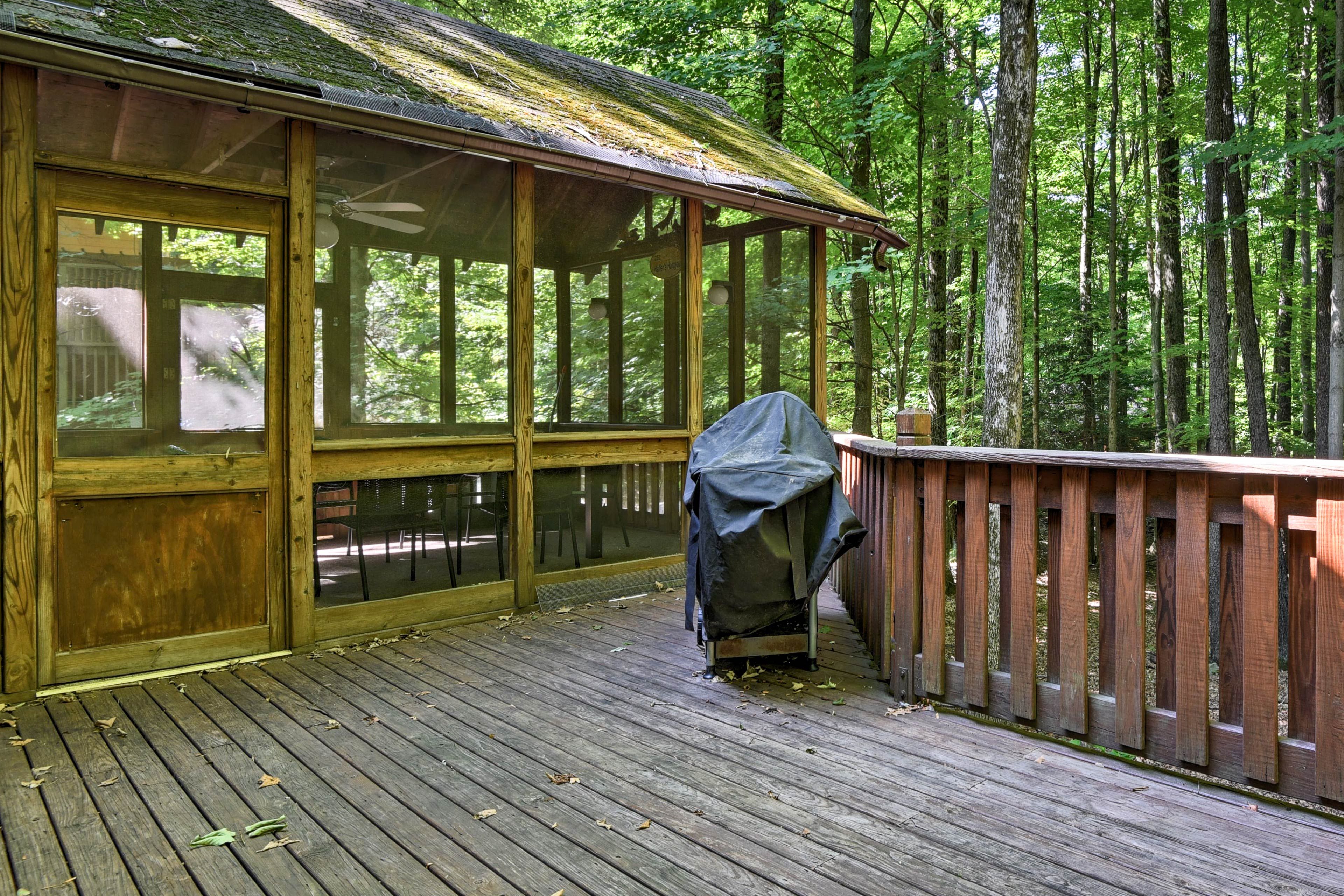 Scenes of wooded serenity surround the back deck.