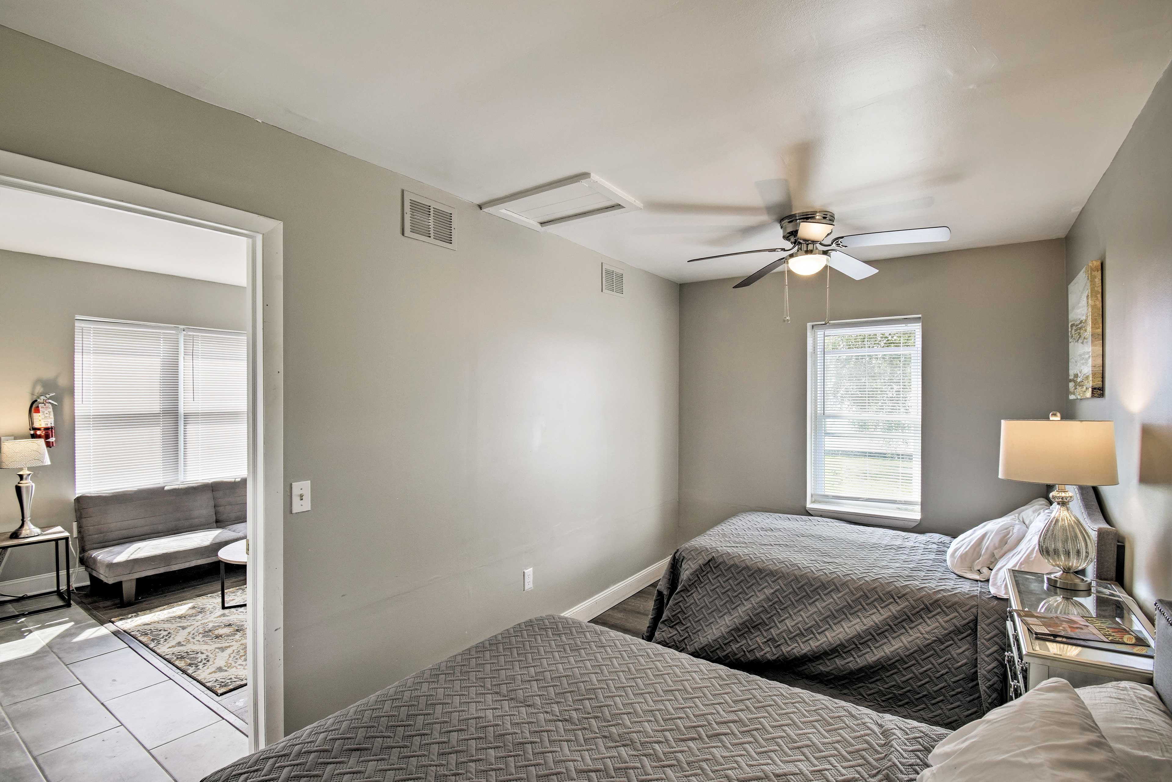 This bedroom contains 2 queen-sized beds!