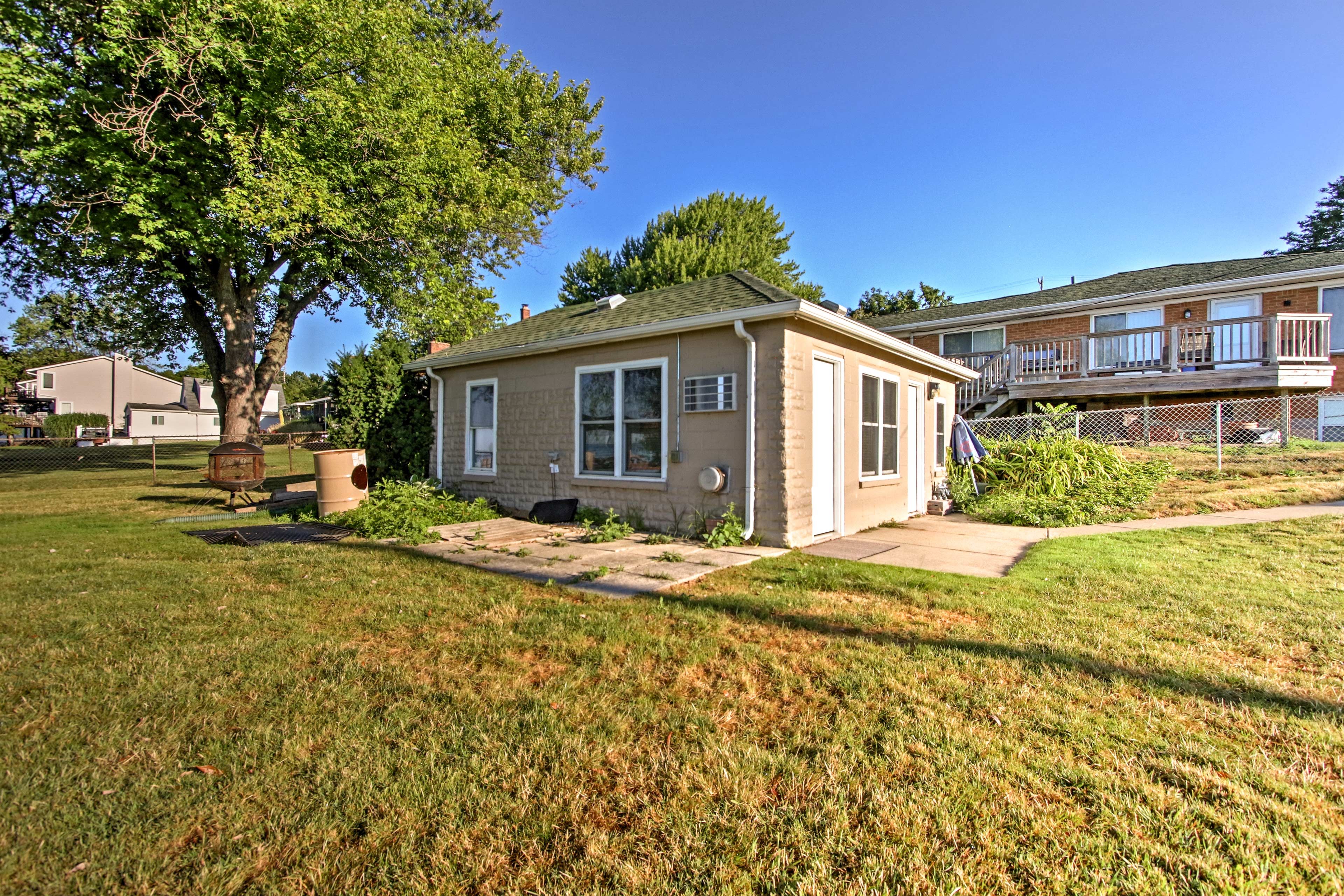 The cottage is tucked away near the lake.