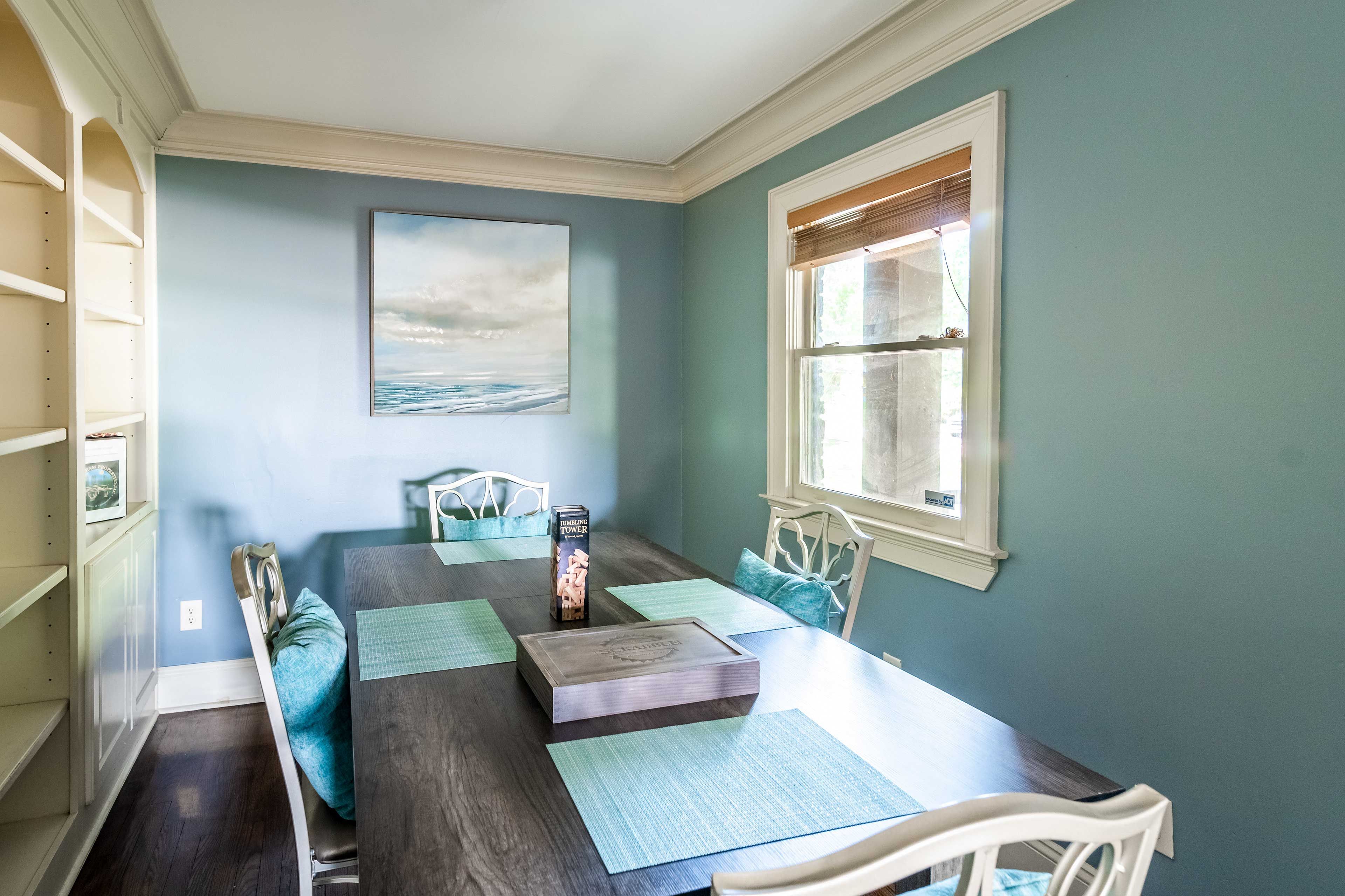 Share meals and play games around the dining table with seating for 4.