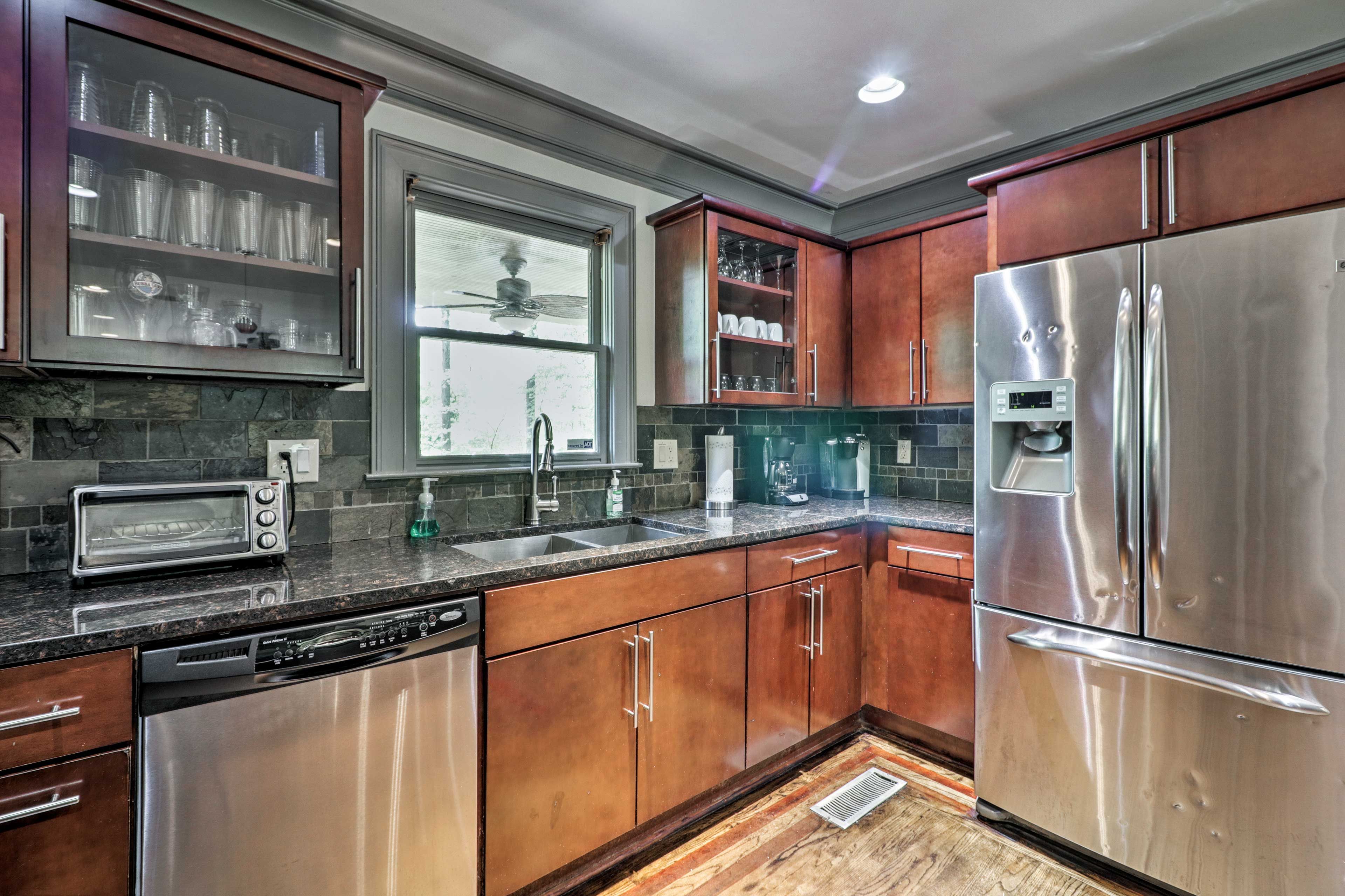 The fully equipped kitchen features stainless steel appliances.