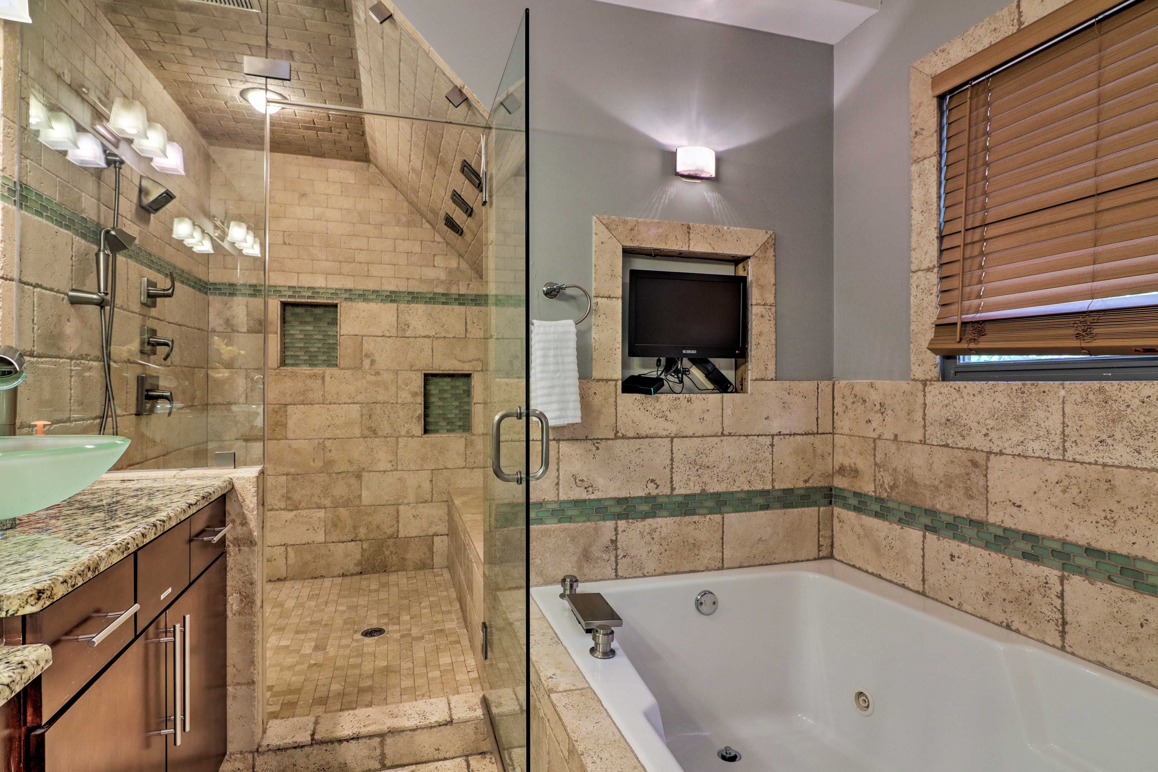 Soak in the jetted tub while watching TV.