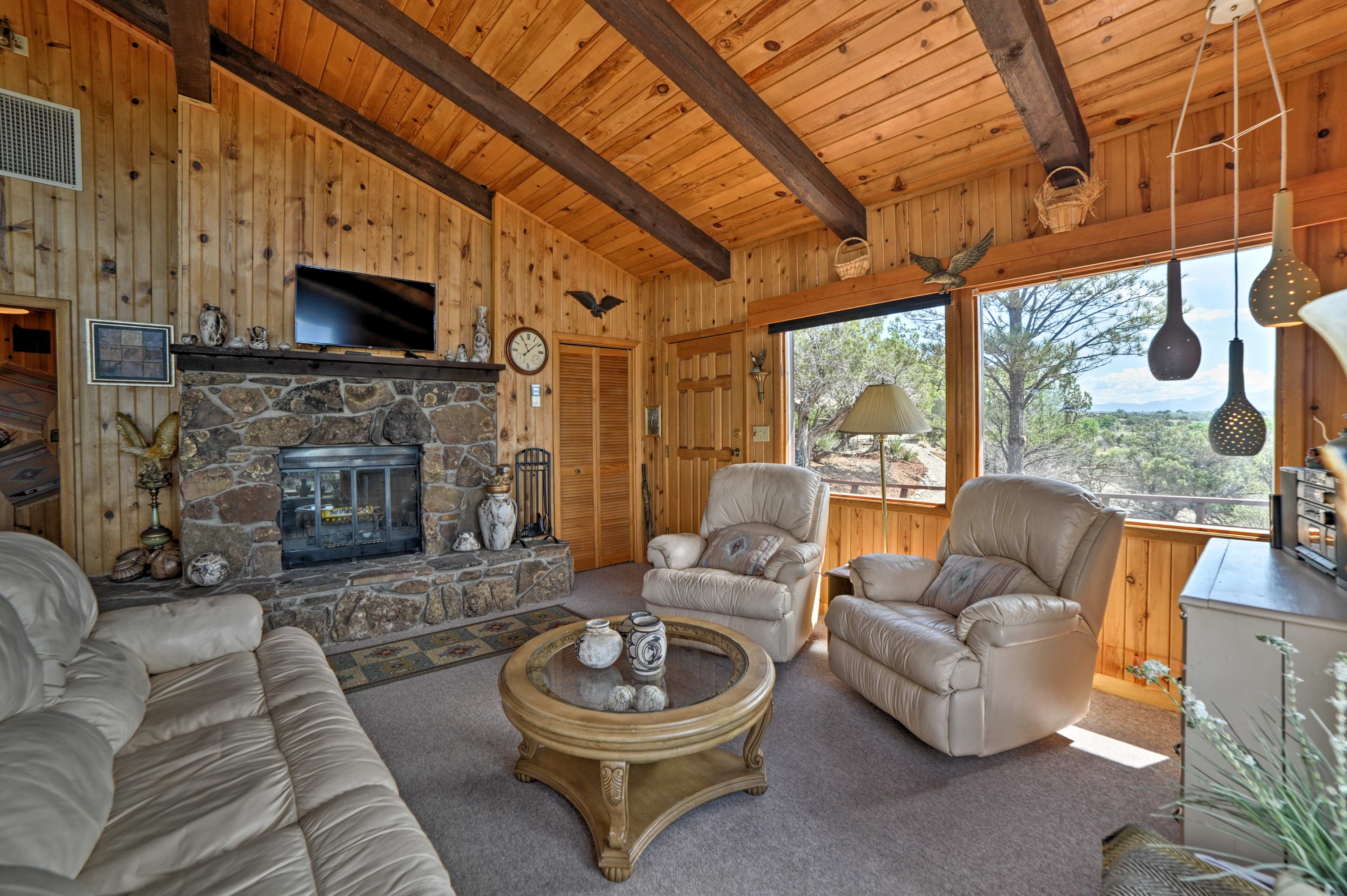 A stone fireplace and flat-screen Smart TV highlight the living room.