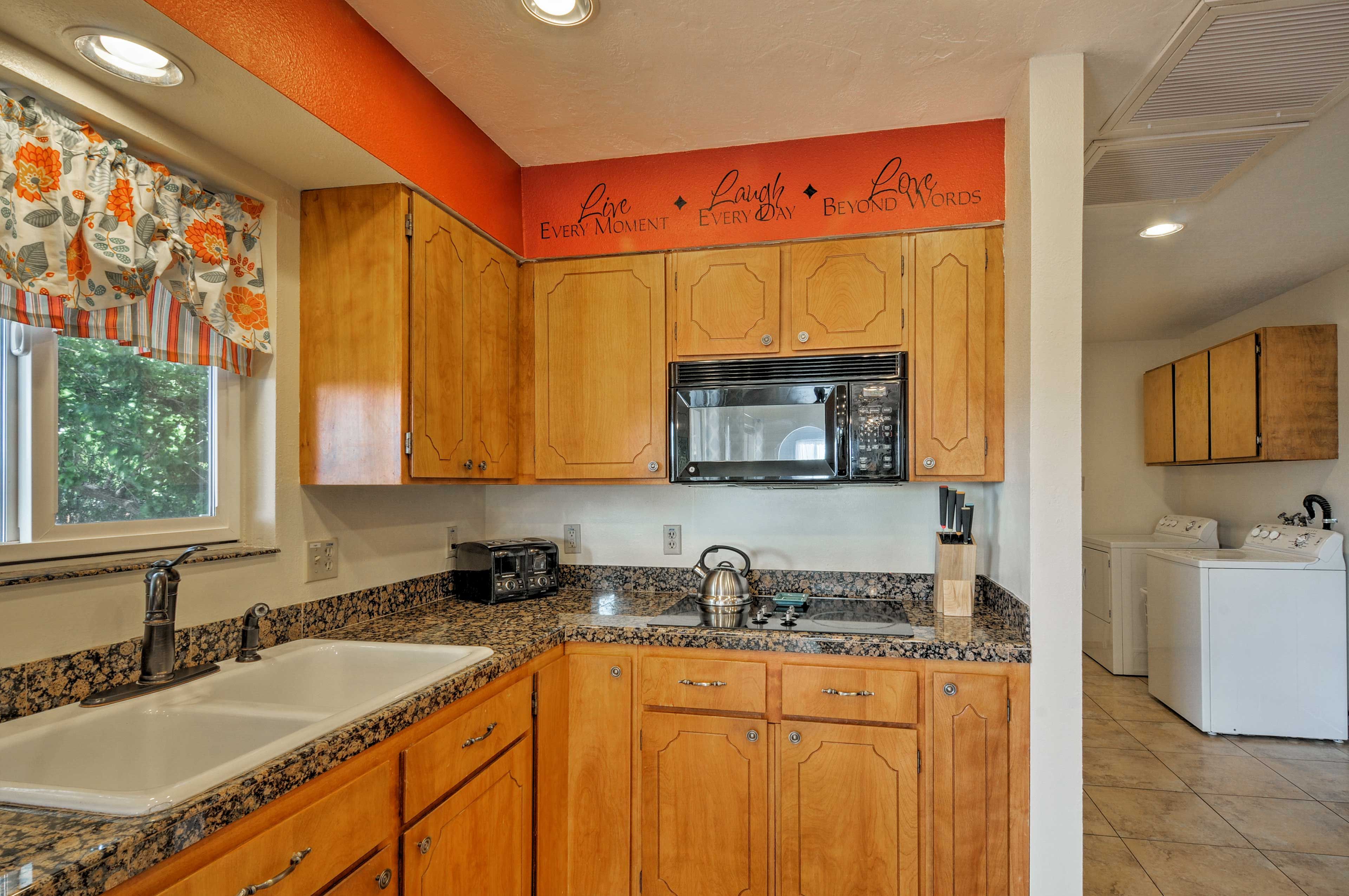 Wooden cabinets provide plenty of storage space for all of your cooking needs.