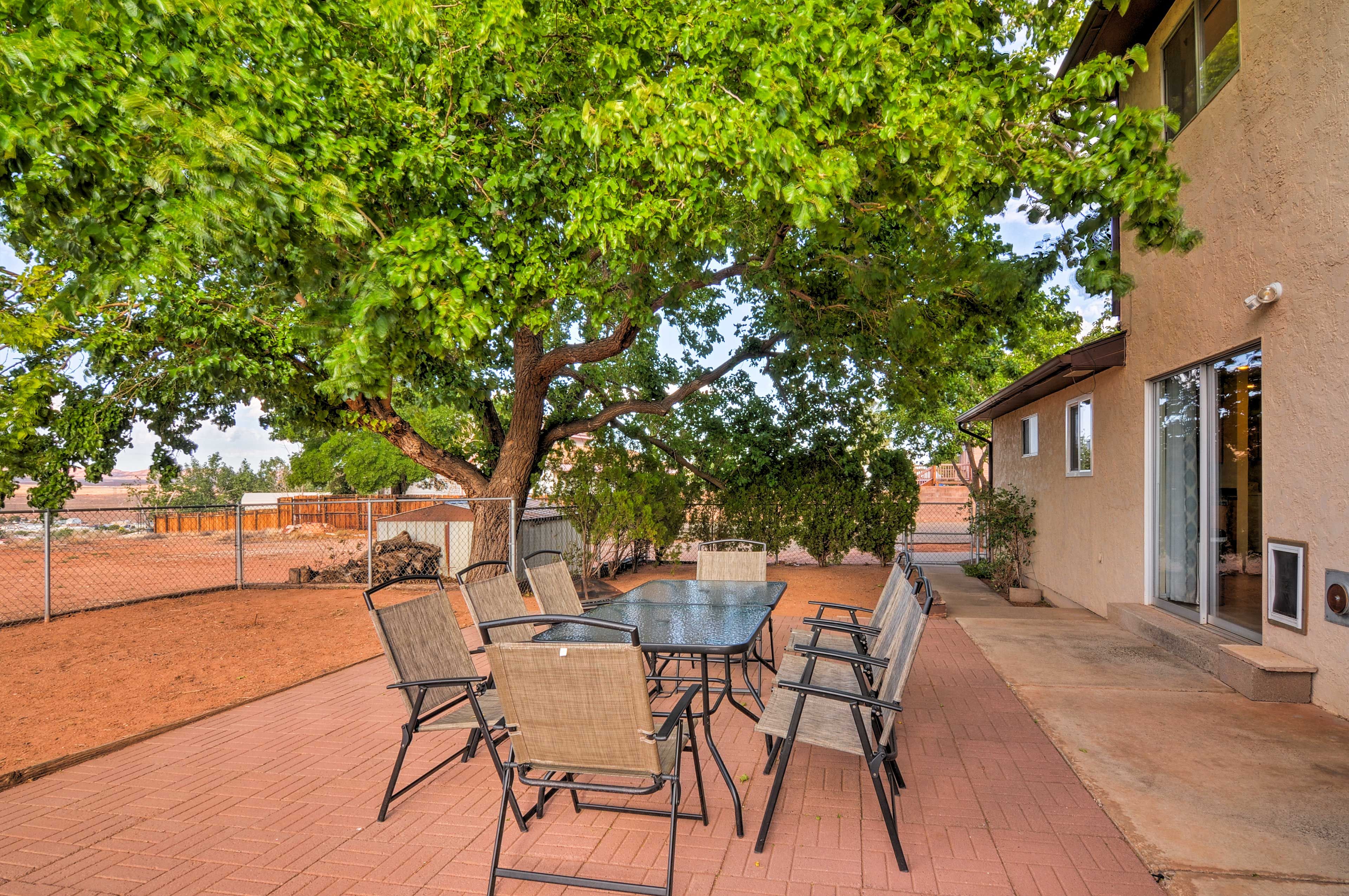 Savor home-cooked meals al fresco around the 8-person dining table.