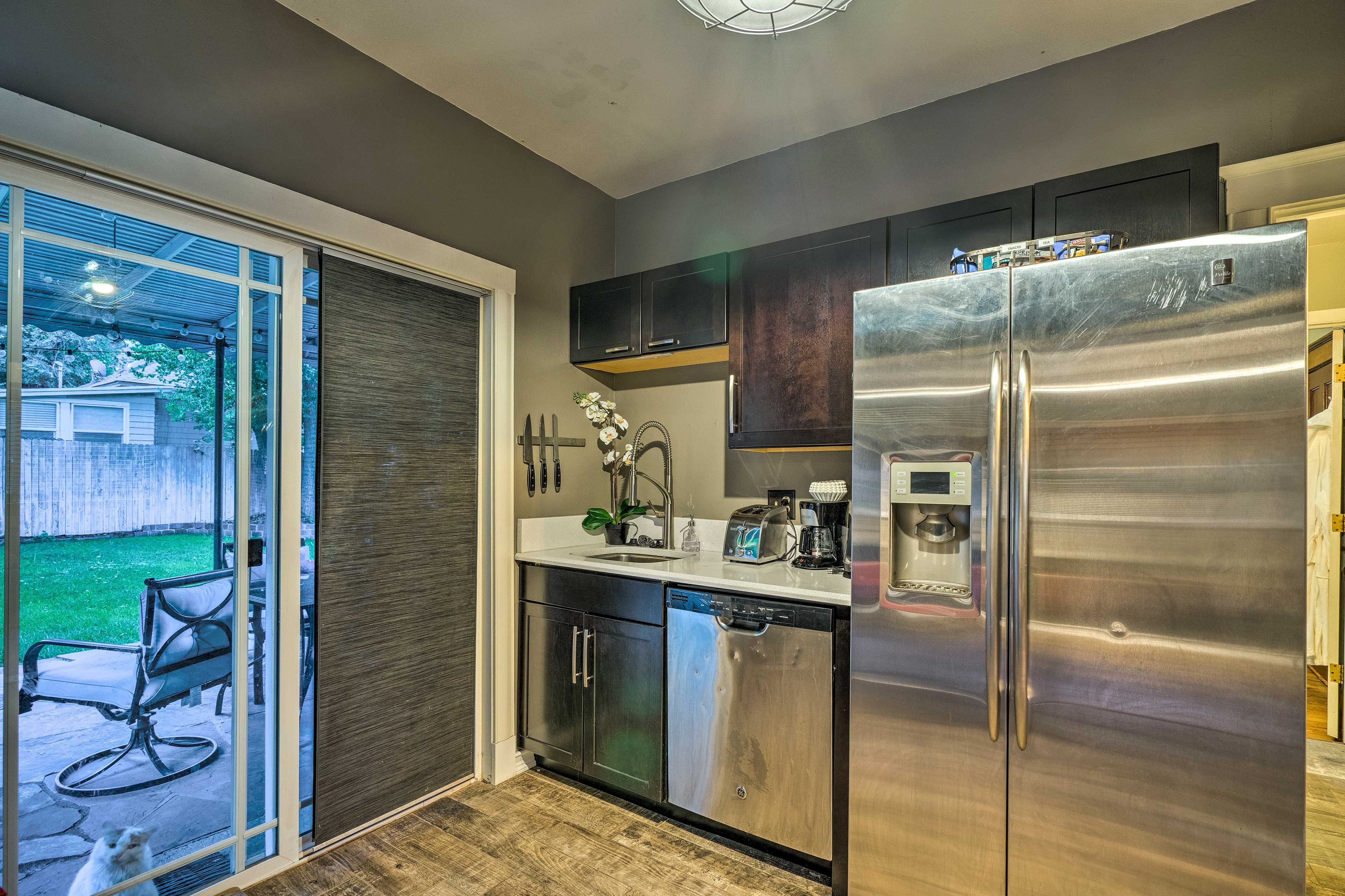 The kitchen features stainless steel appliances and sleek countertops!