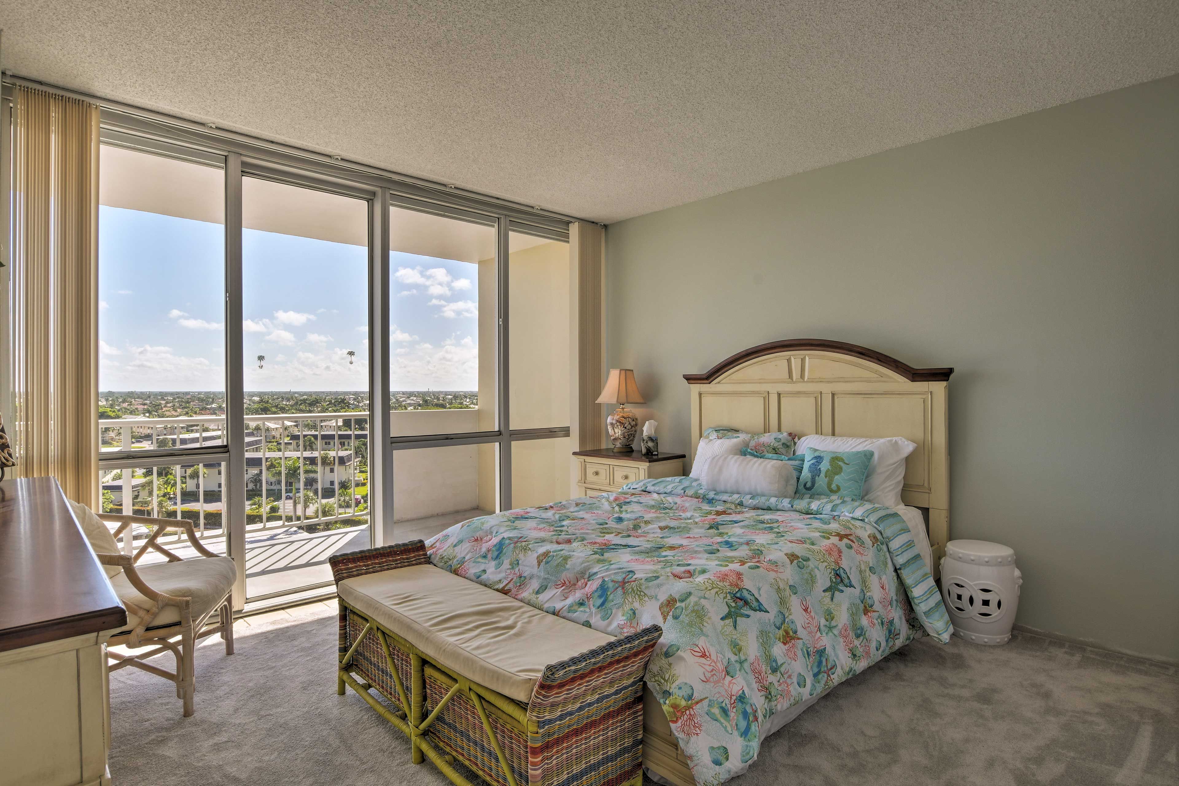 Both bedrooms connect to a balcony overlooking the city.
