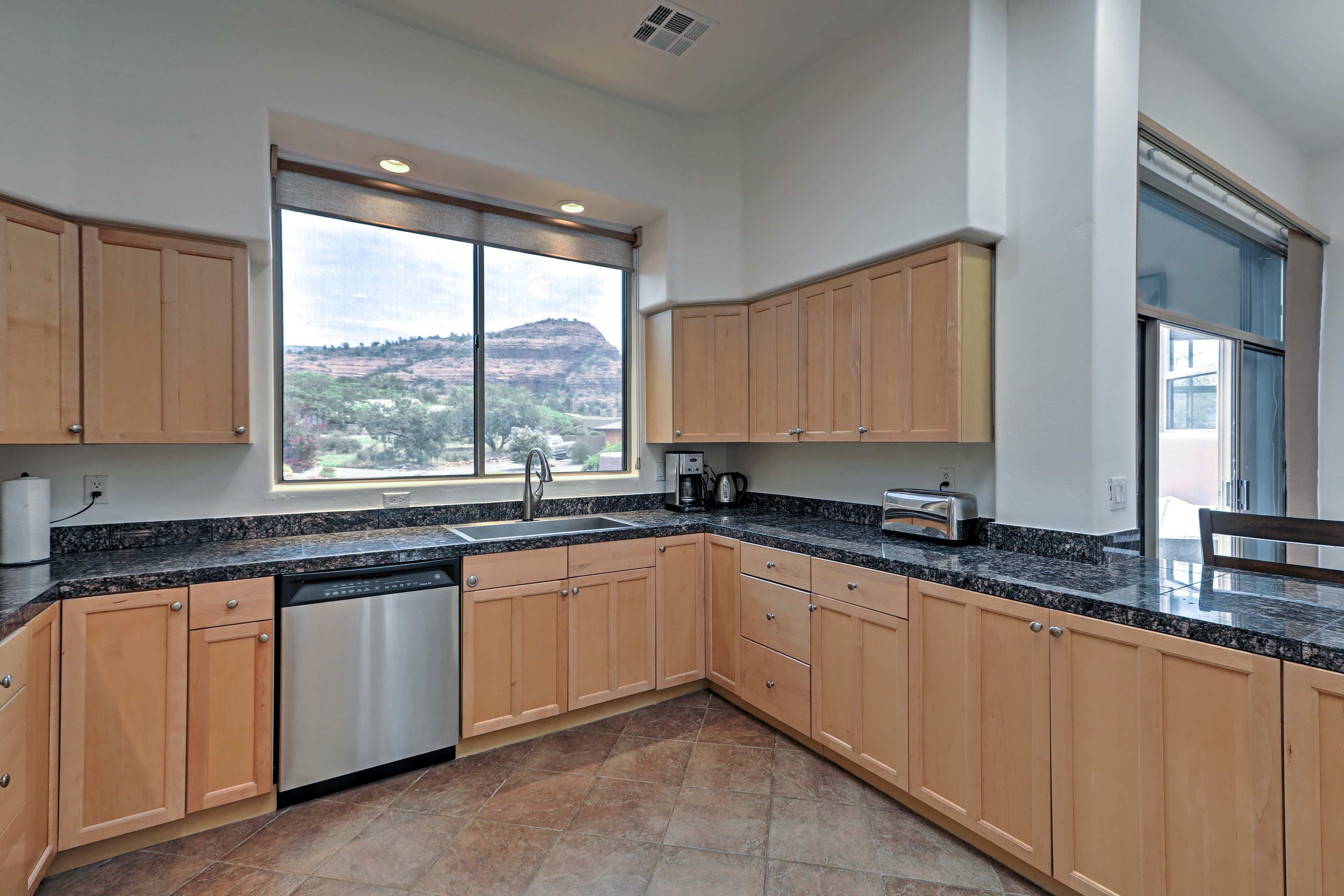 Large picture windows reveal red rock formations in the kitchen.