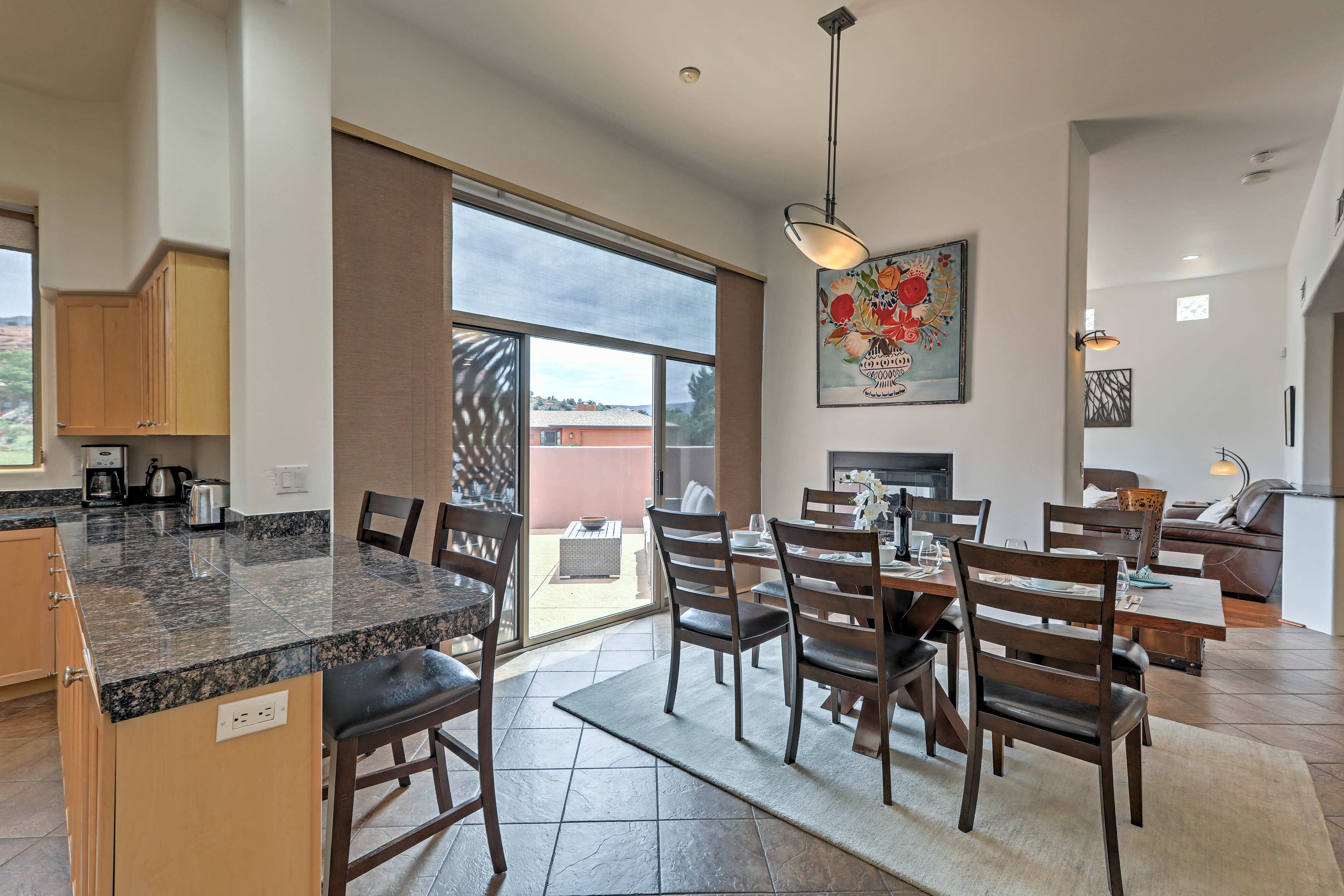 Large sliding doors connect the dining area to one of the home's many decks.
