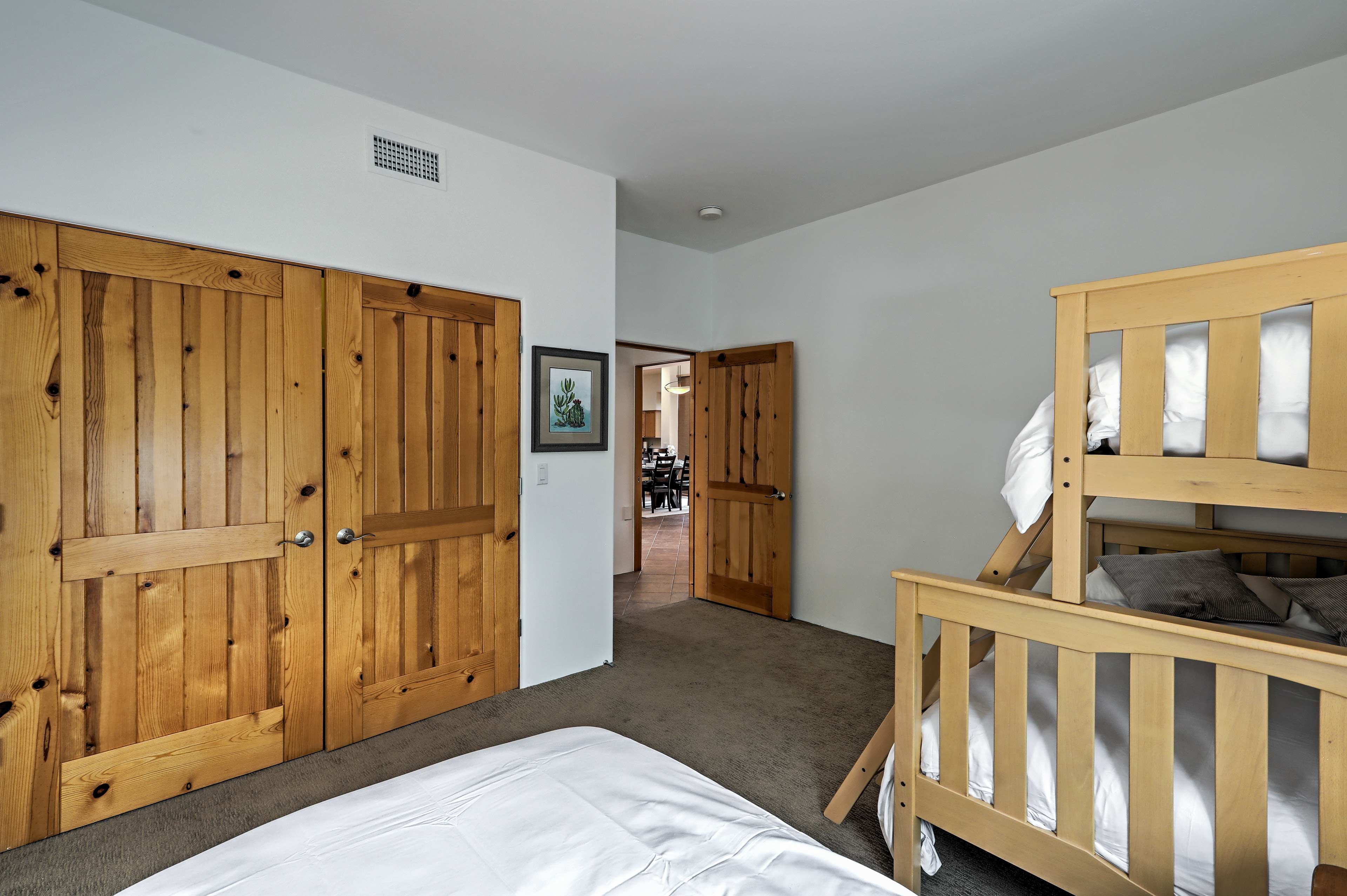This room houses a twin bed and twin-over-full bunk bed.