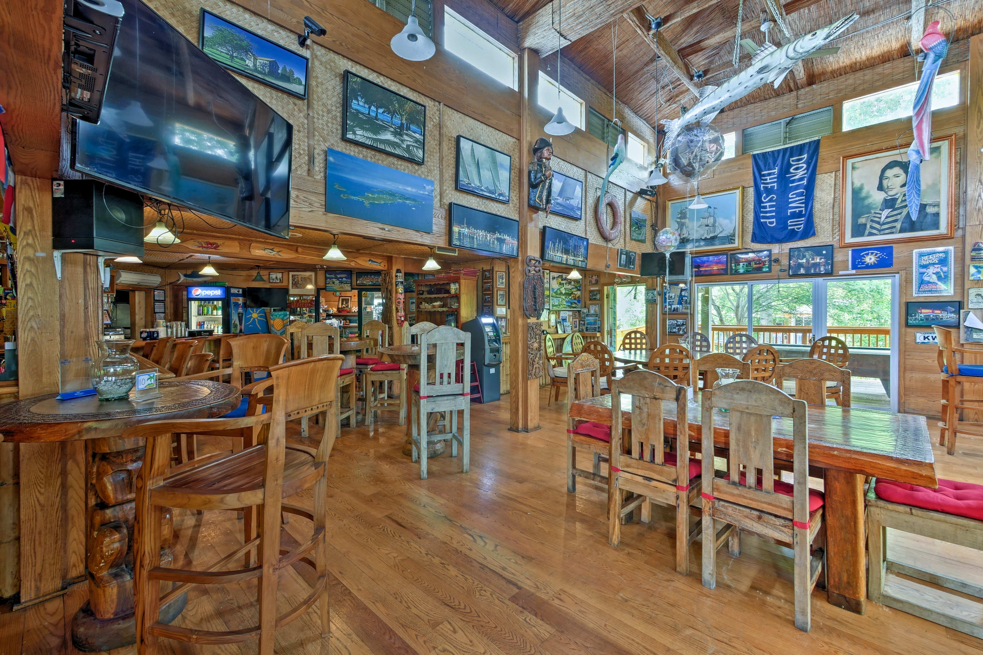 Inside, the bar and grill boasts nautical decor and TVs.