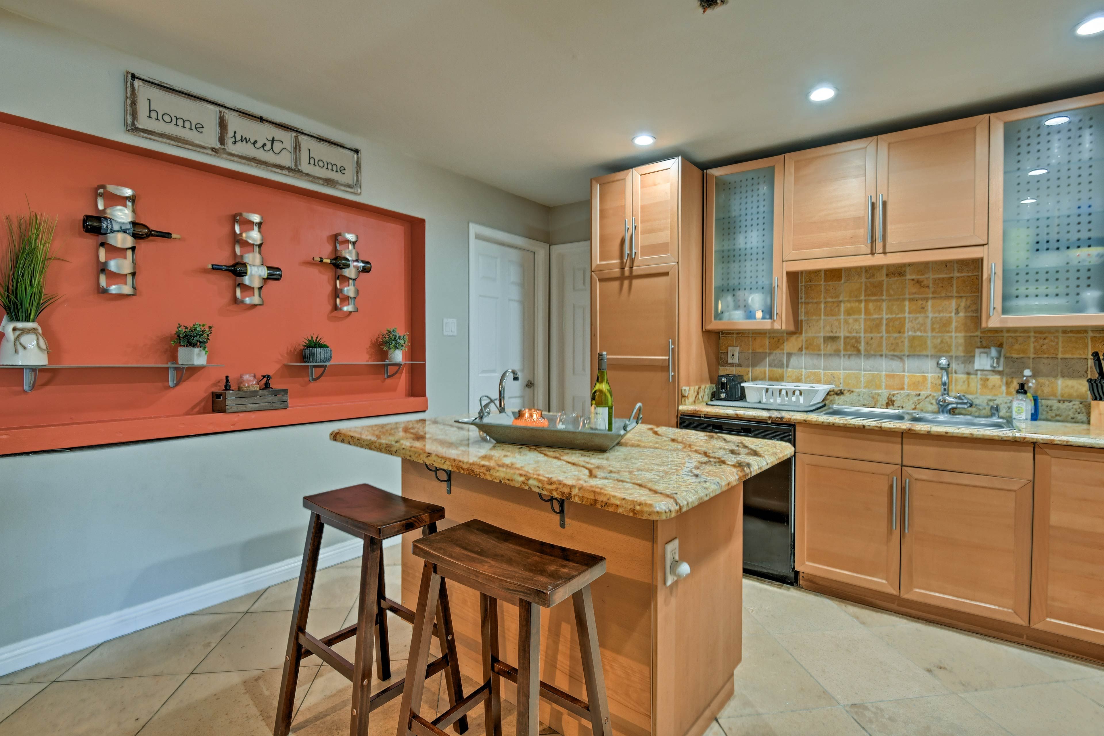 Saddle up to the center-island bar while the group's chef prepares dinner.