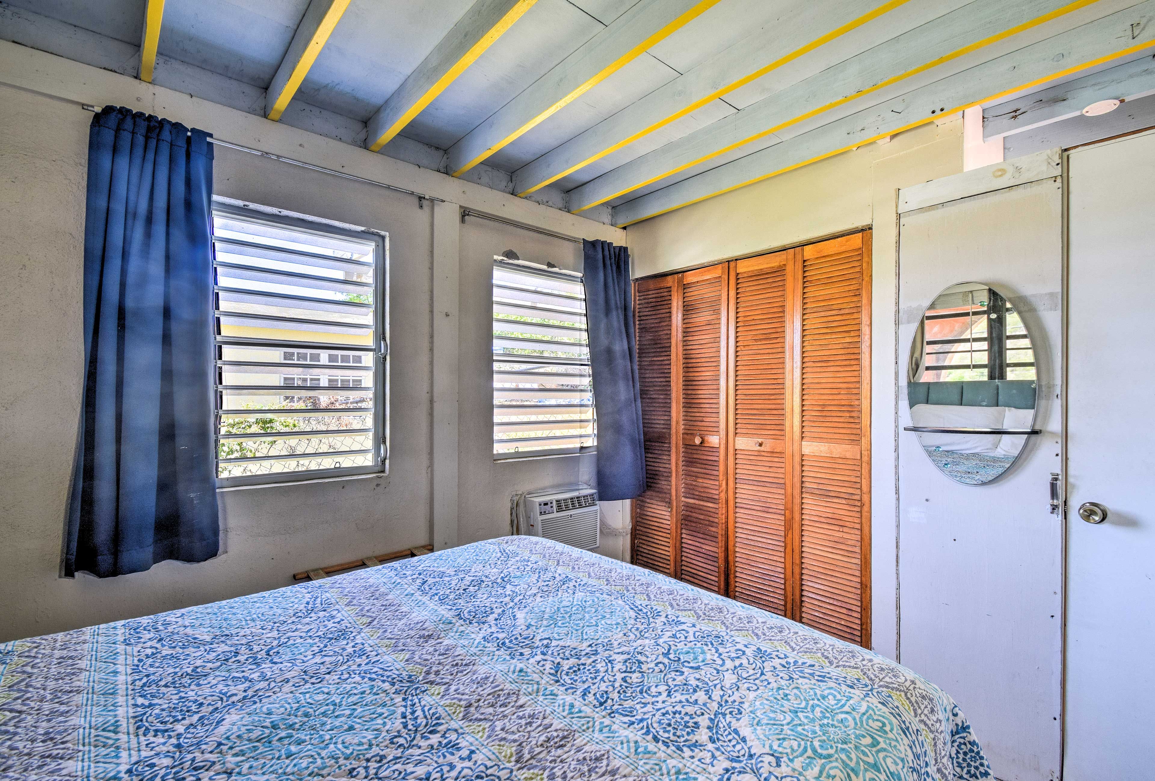 Curl up under the covers of this queen bed.