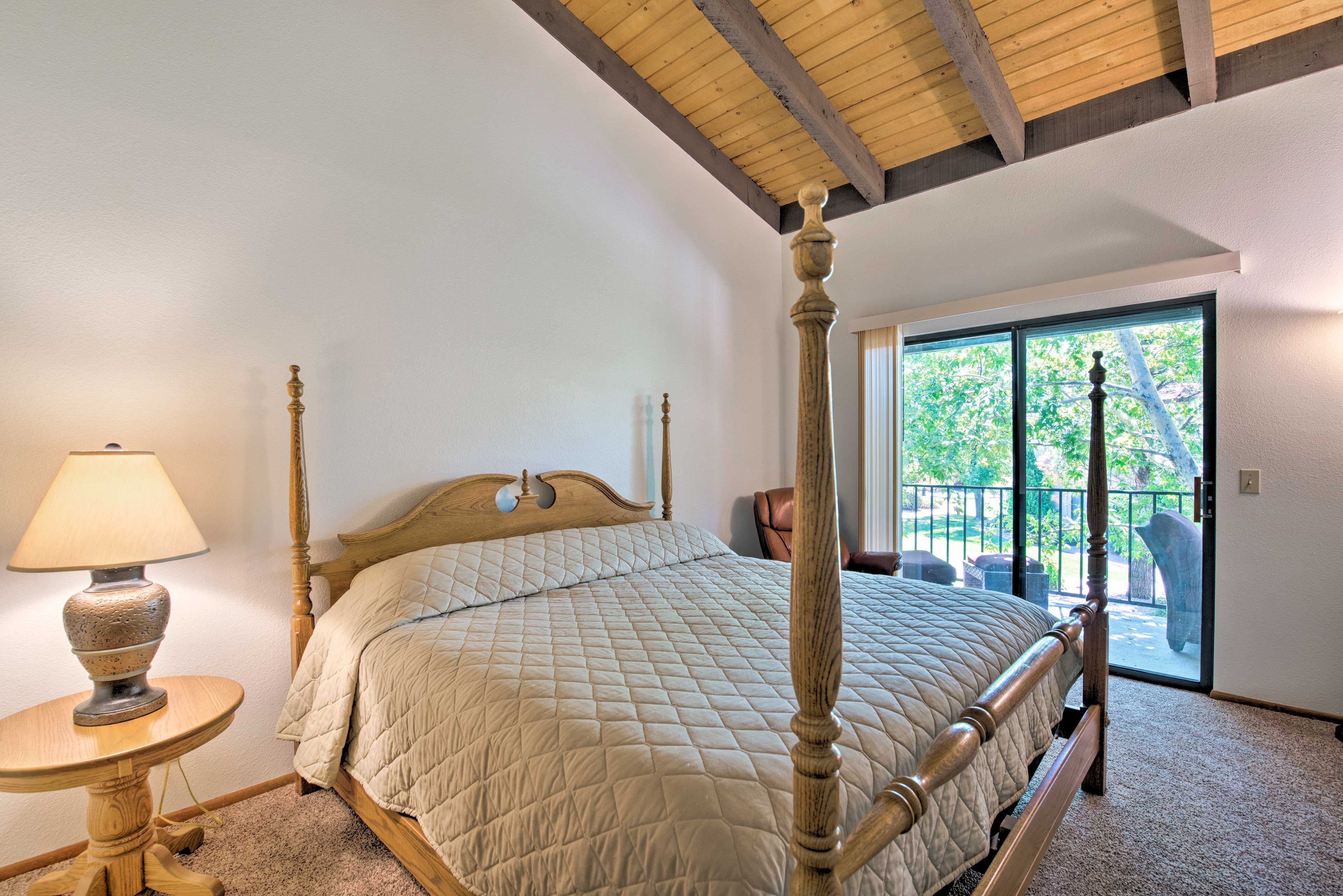 The bedroom suite offers private patio access.