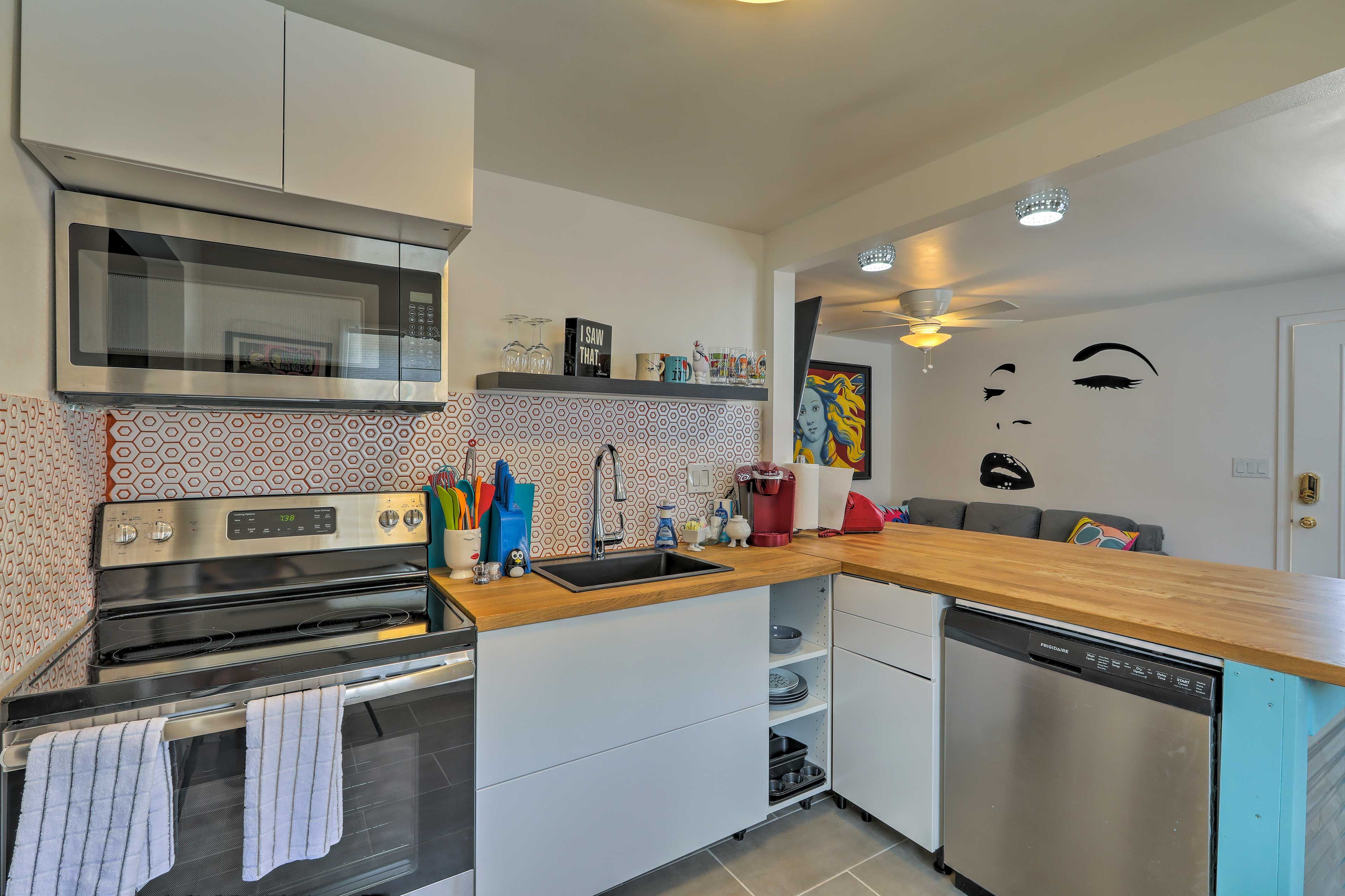 Stainless steel appliances & fashionable tile backsplash complete this kitchen.