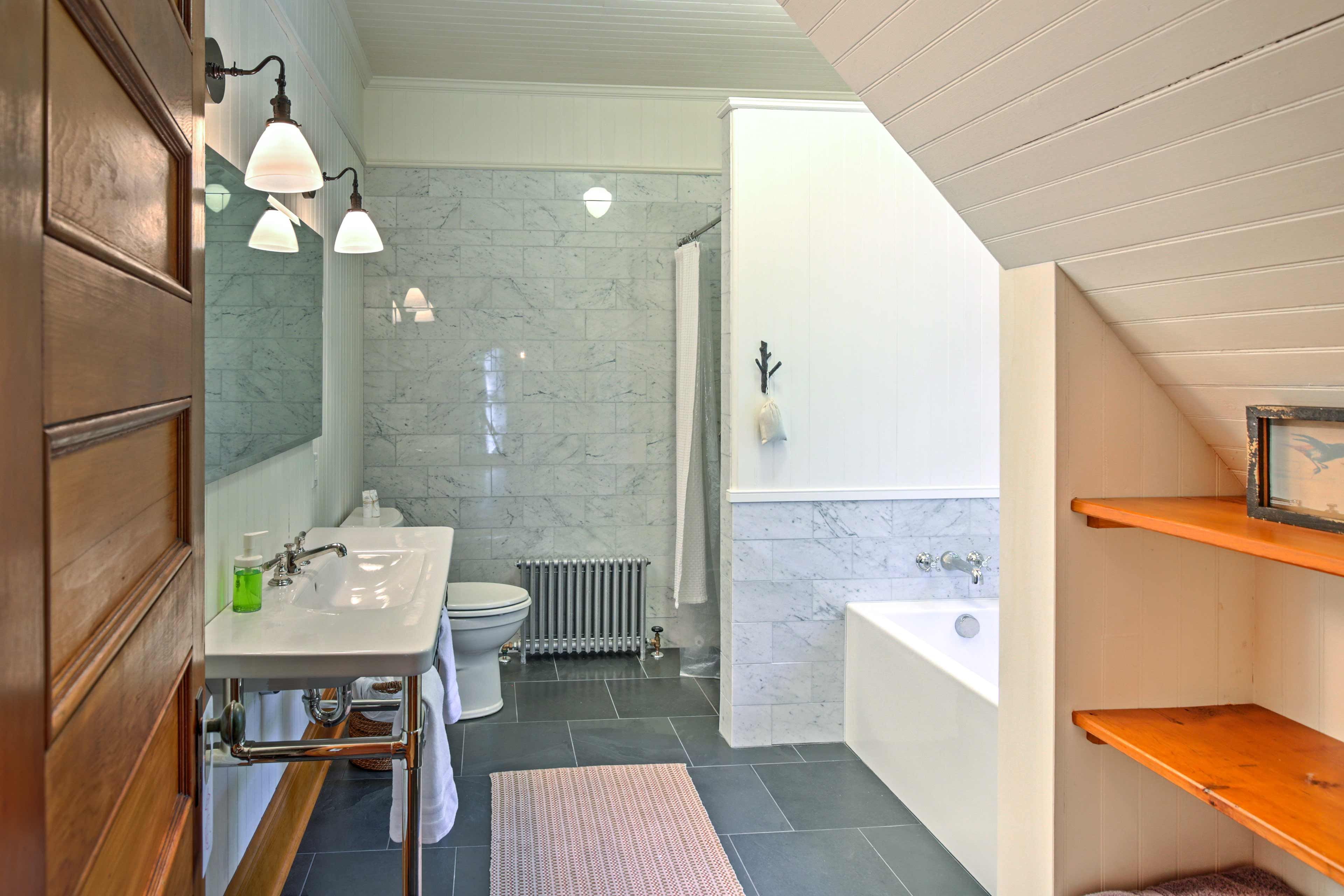 This elegant bathroom offers a luxurious tub.