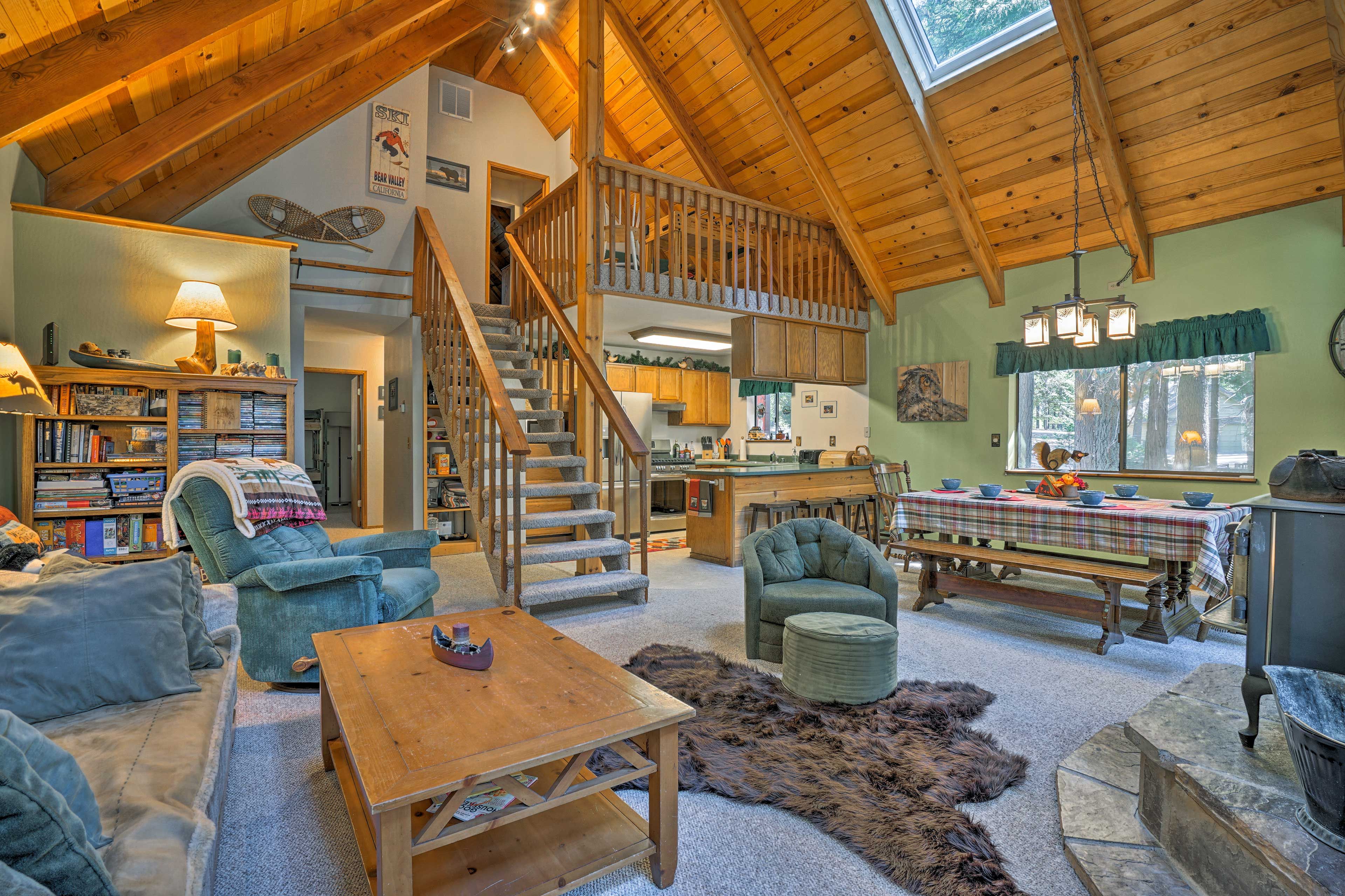 The living area features soaring tongue & groove vaulted ceilings.