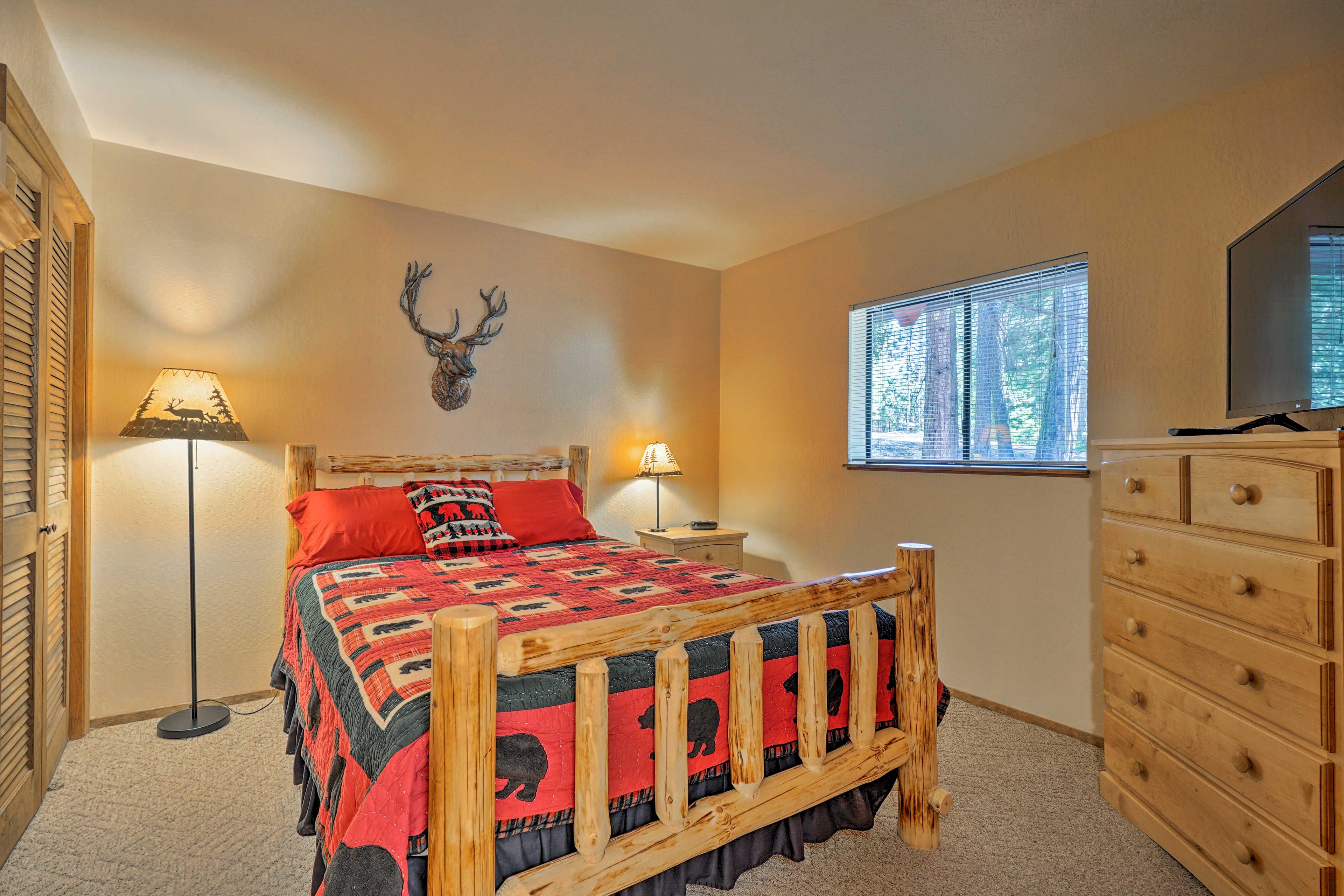 In the cabin's second bedroom, 2 travelers can watch TV under the covers!