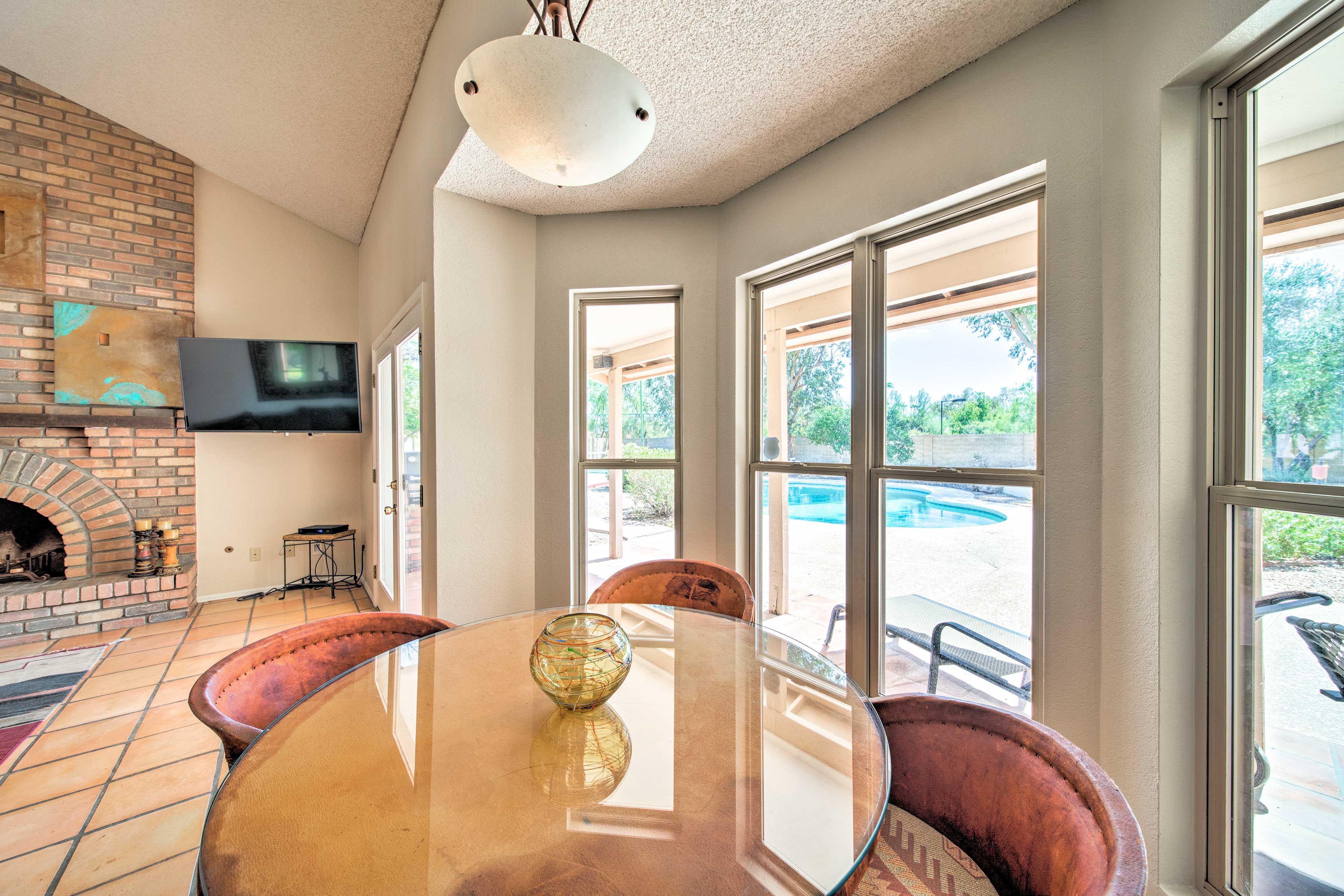Enjoy causal meals at this glossy 4-person table.