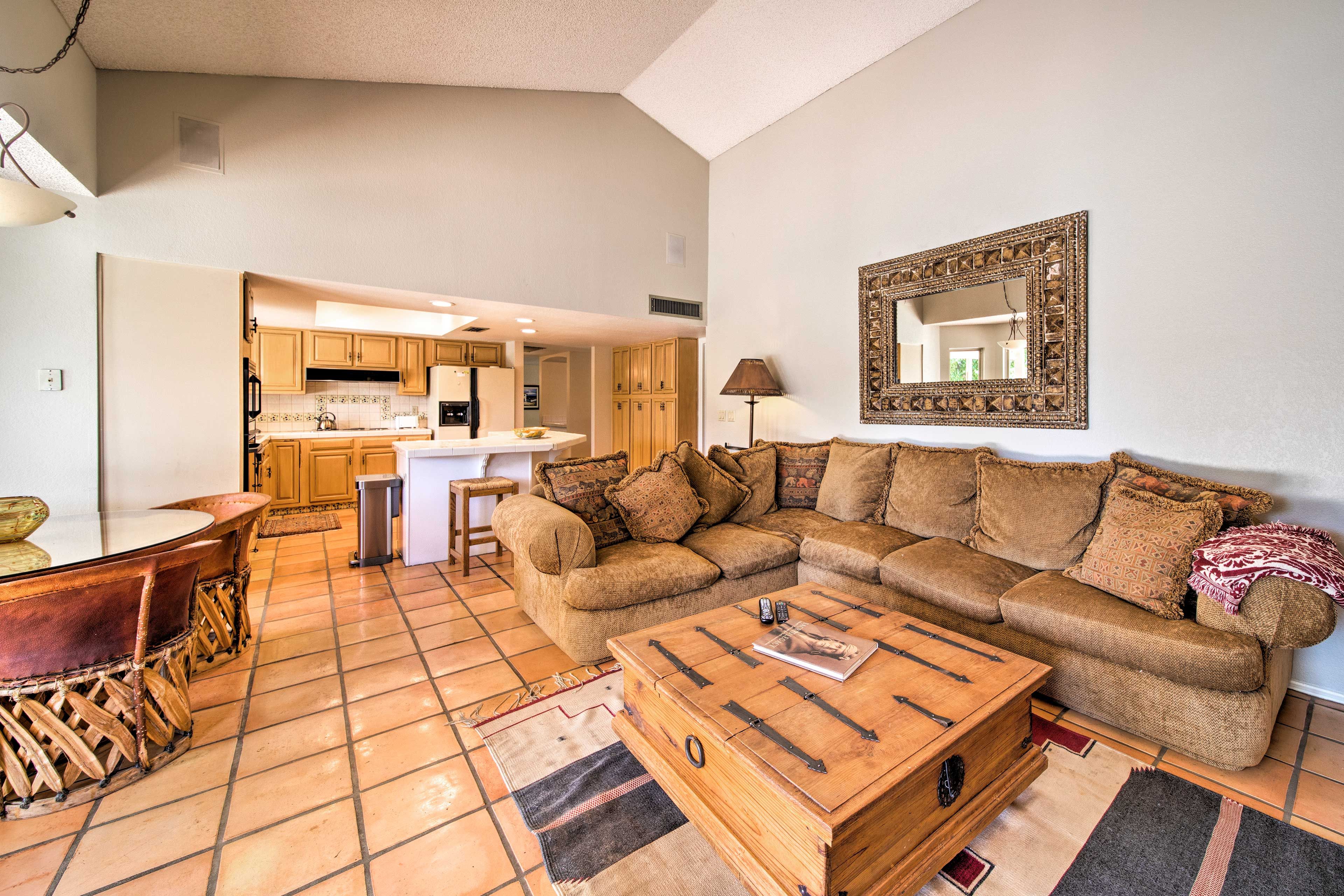 Melt into the L-shaped sectional sofa to watch the flat-screen cable TV.