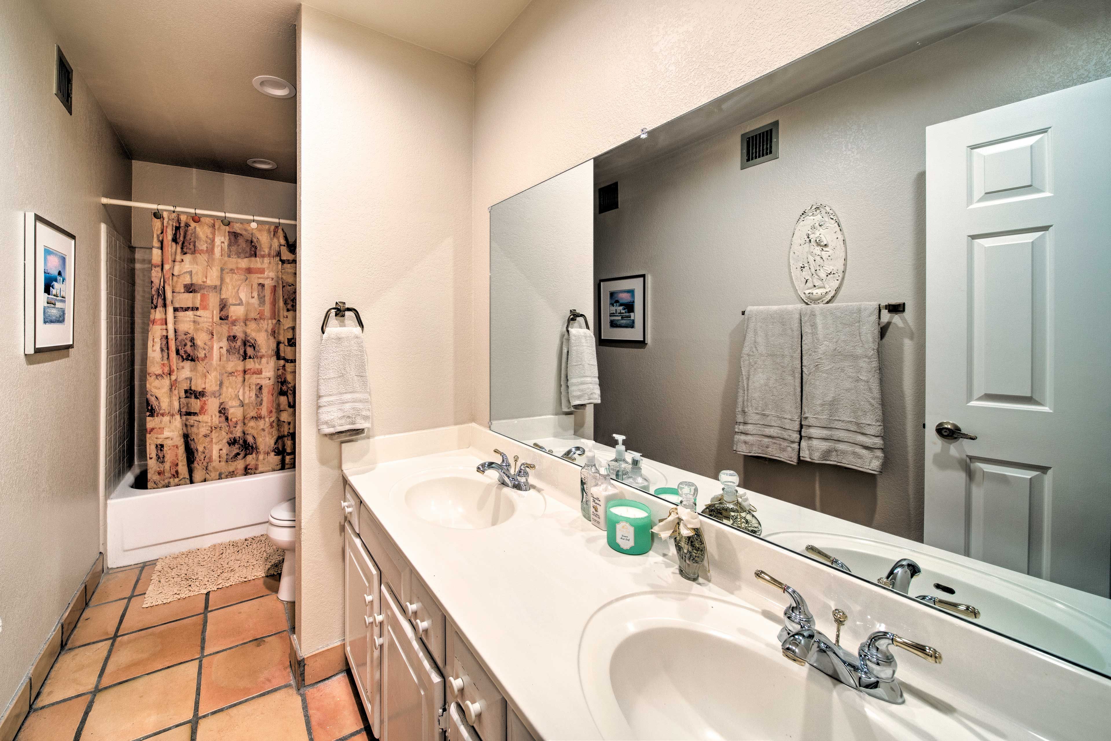 Each bathroom is stocked with fresh towels.