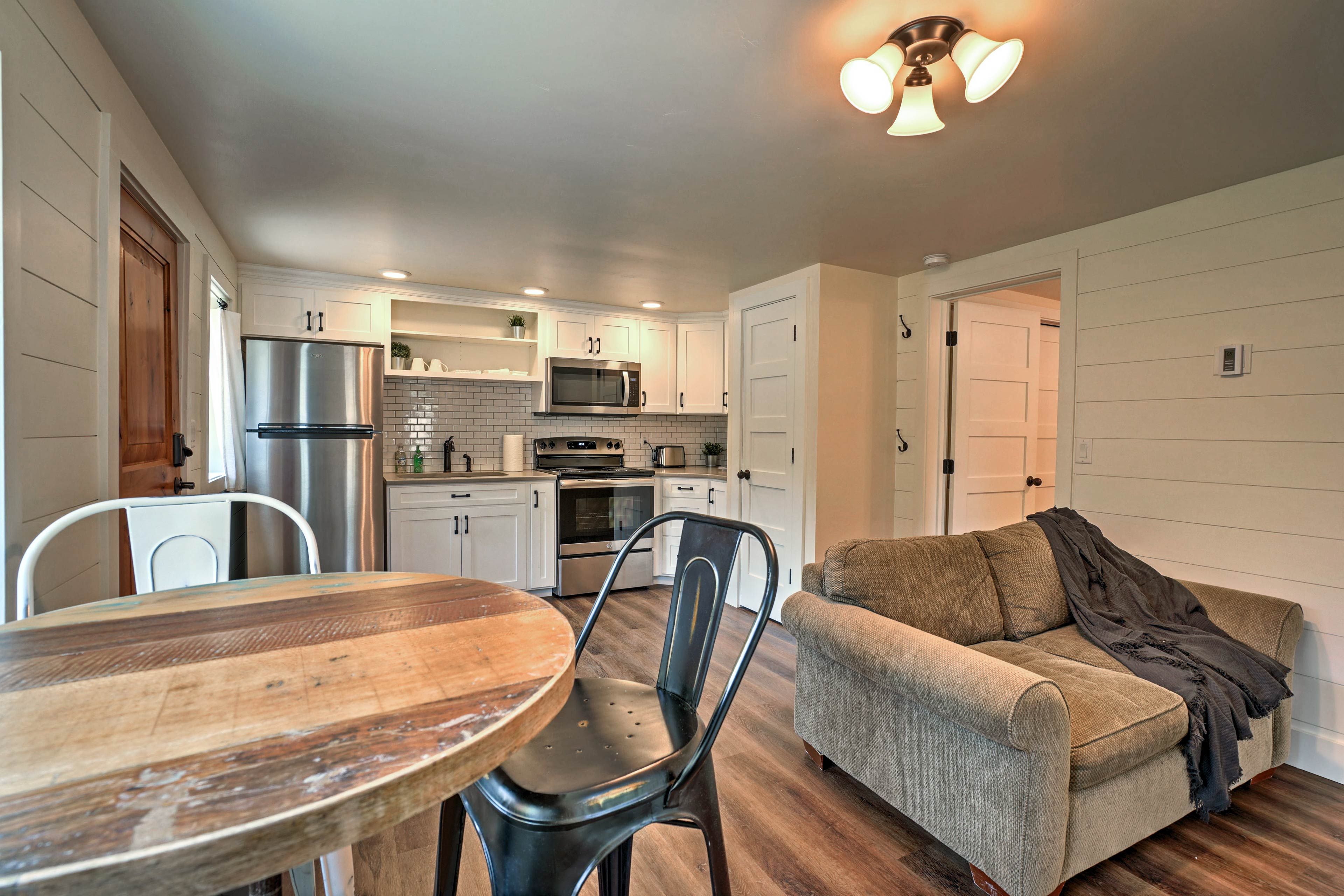 Dine together at the rustic high-top hardwood table.