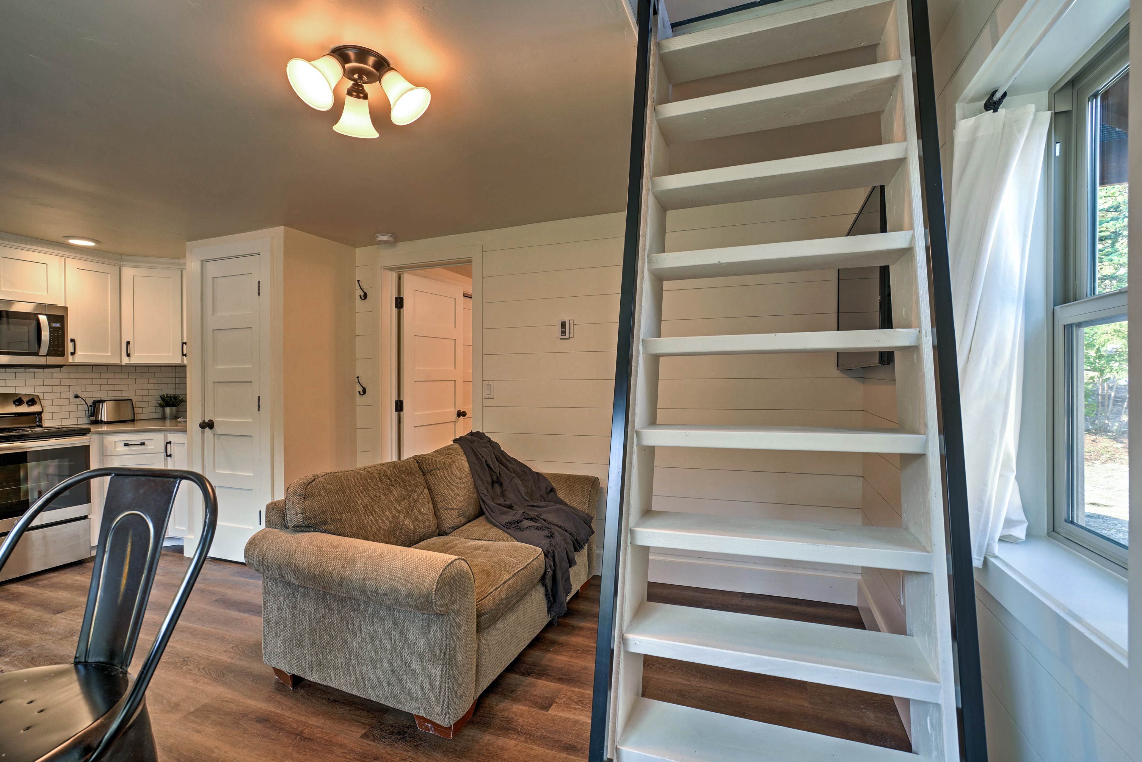 Take it easy on the plush couch while watching a movie on the flat-screen TV.