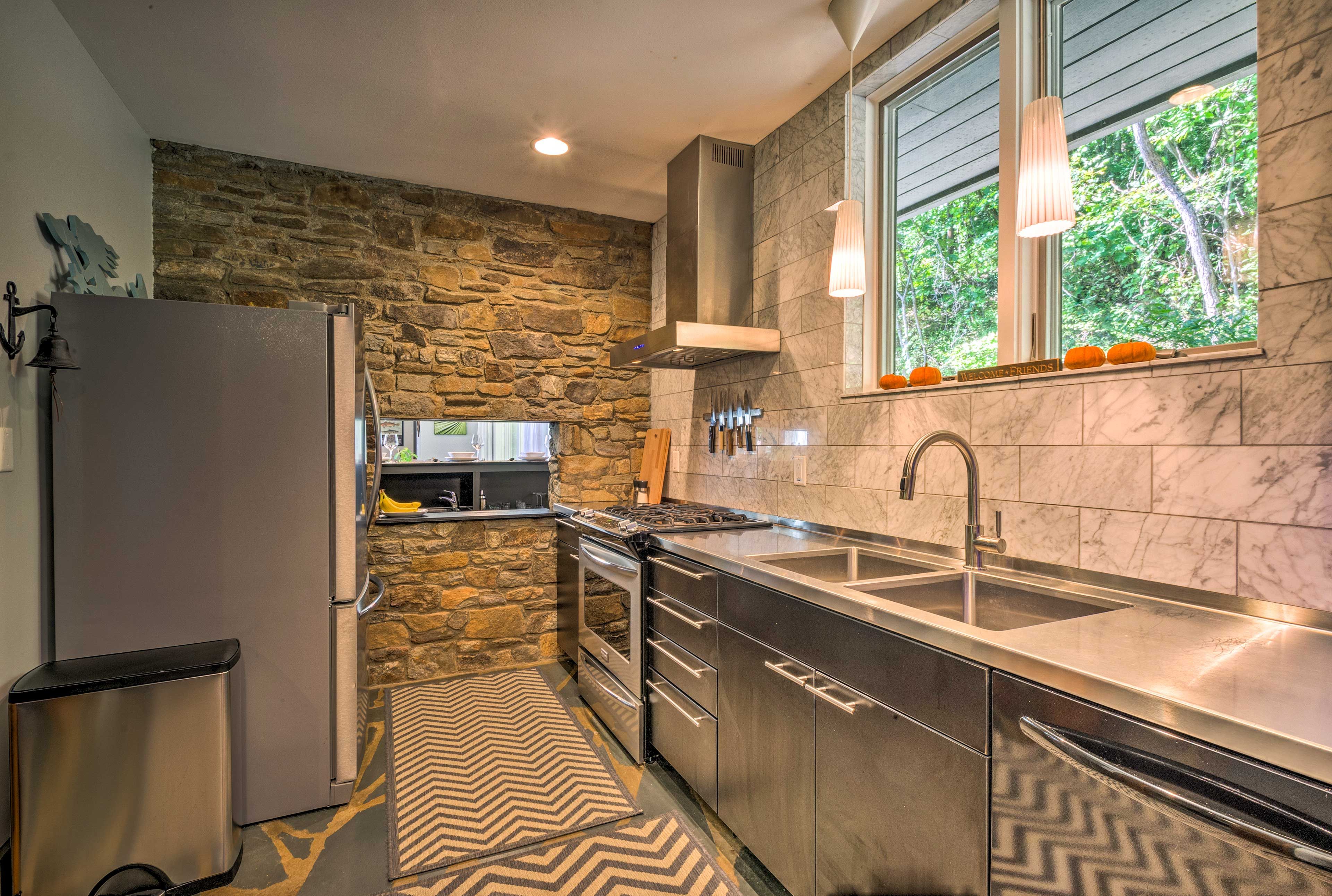 The kitchen is decked out with stainless steel appliances.
