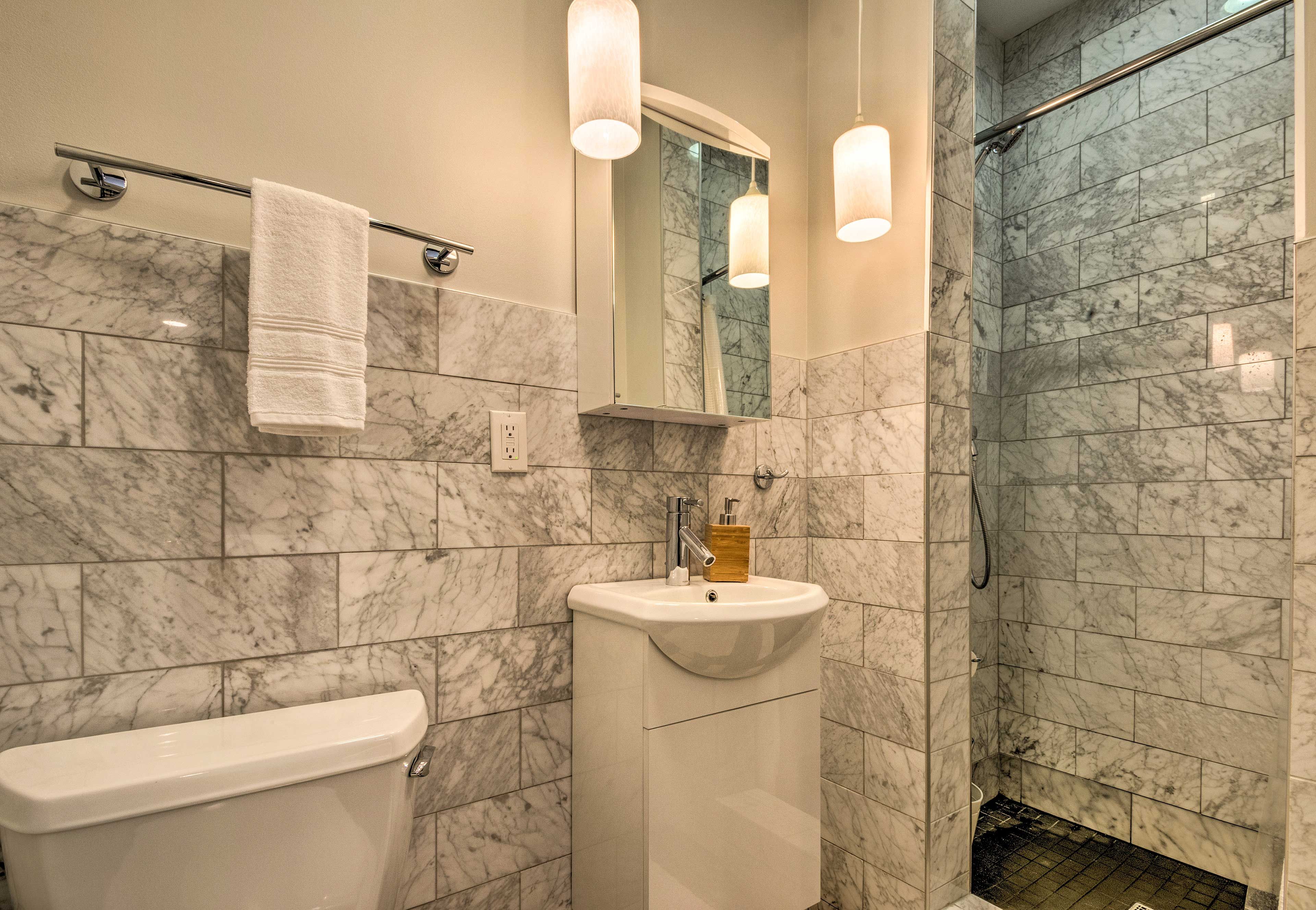 All 3 custom bathrooms feature marble tiling.