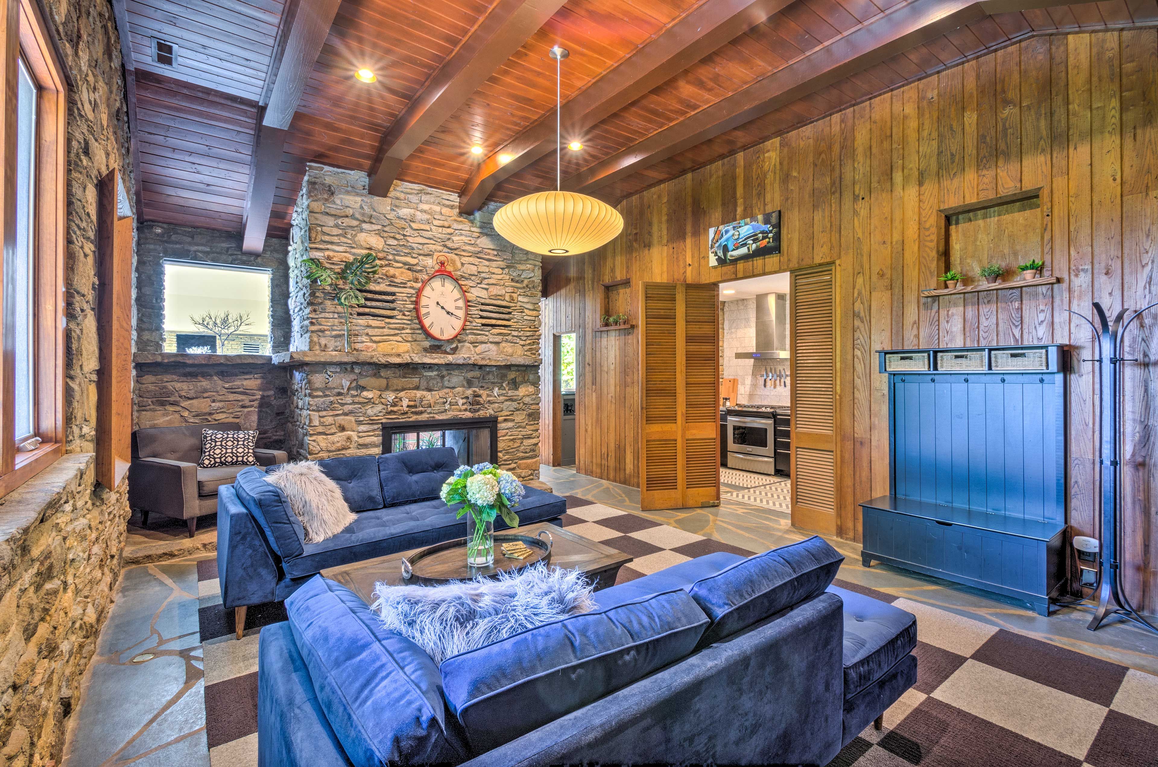 Folding doors conenct the kitchen to this spacious lounge area.
