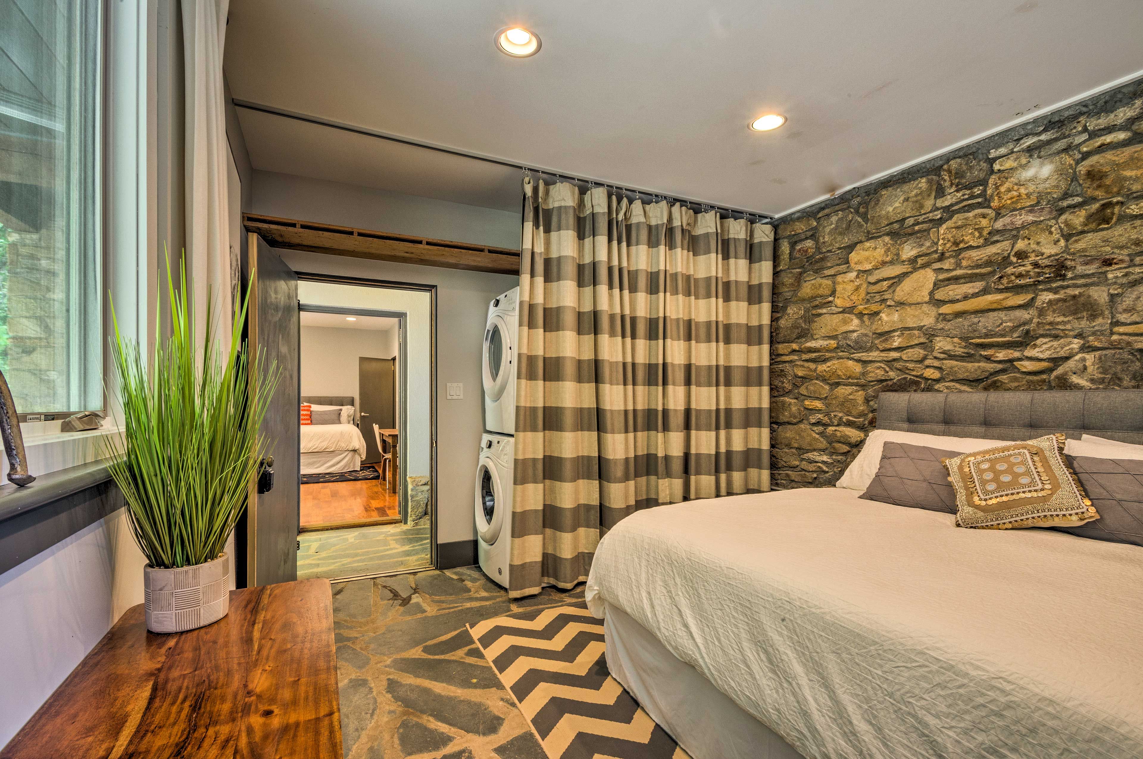Native stonework adds an old-world touch to this bedroom.