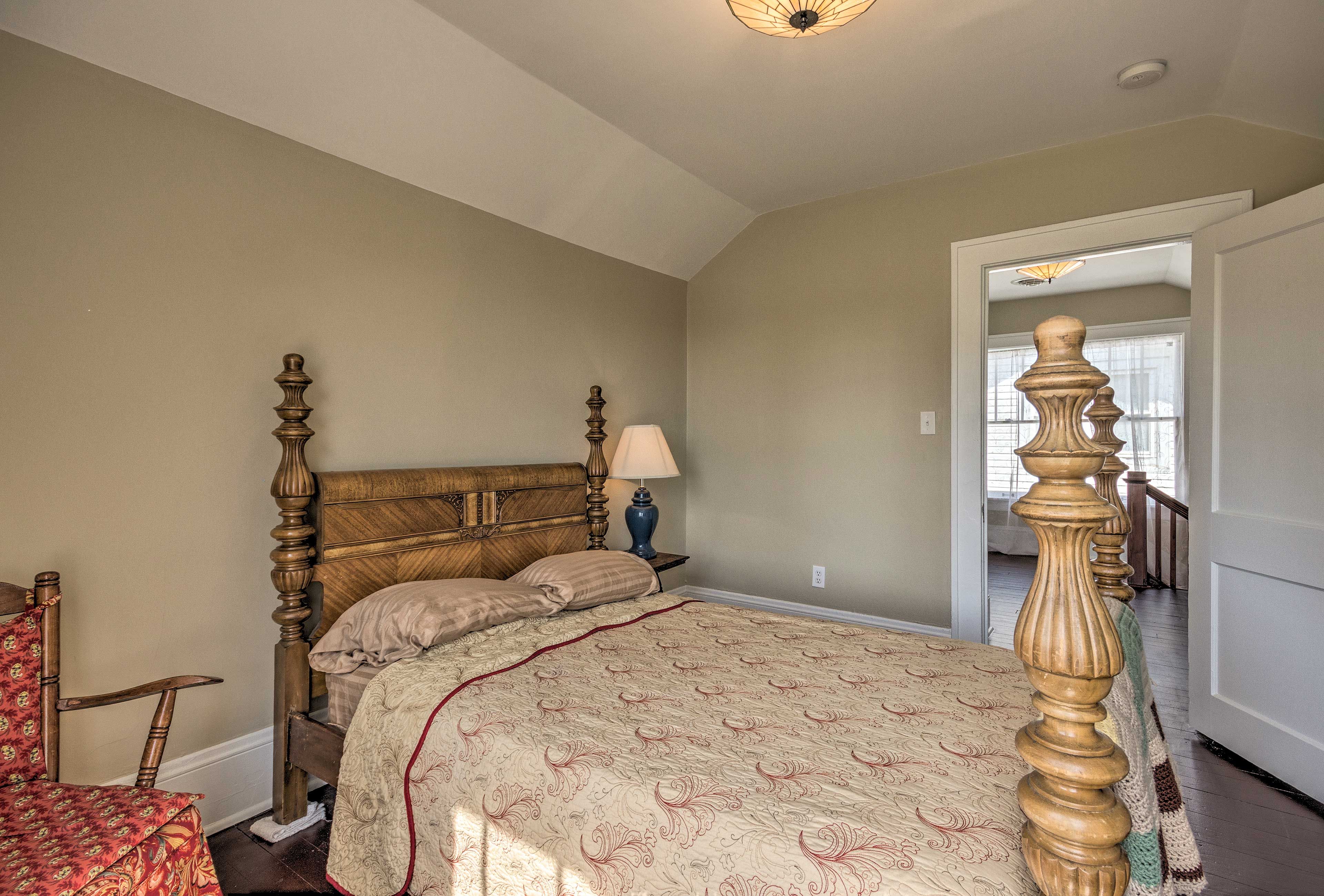 Head upstairs to this bedroom with a queen bed.